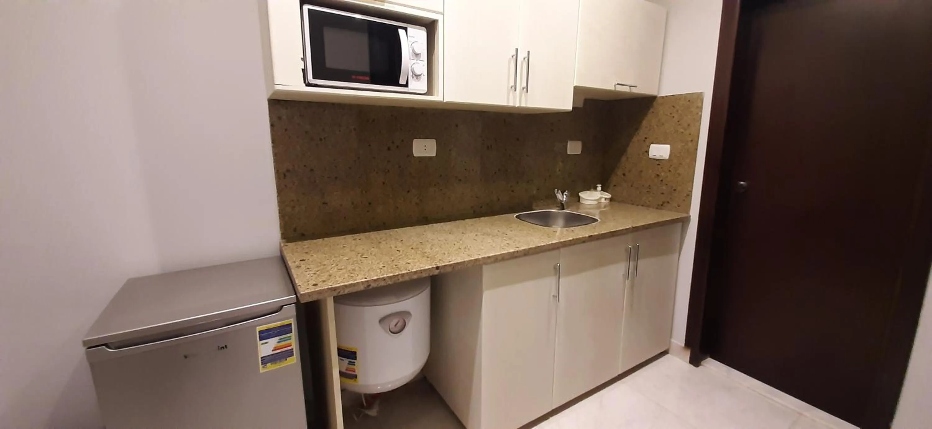 Kitchen or kitchenette in Nakhil Inn Residence