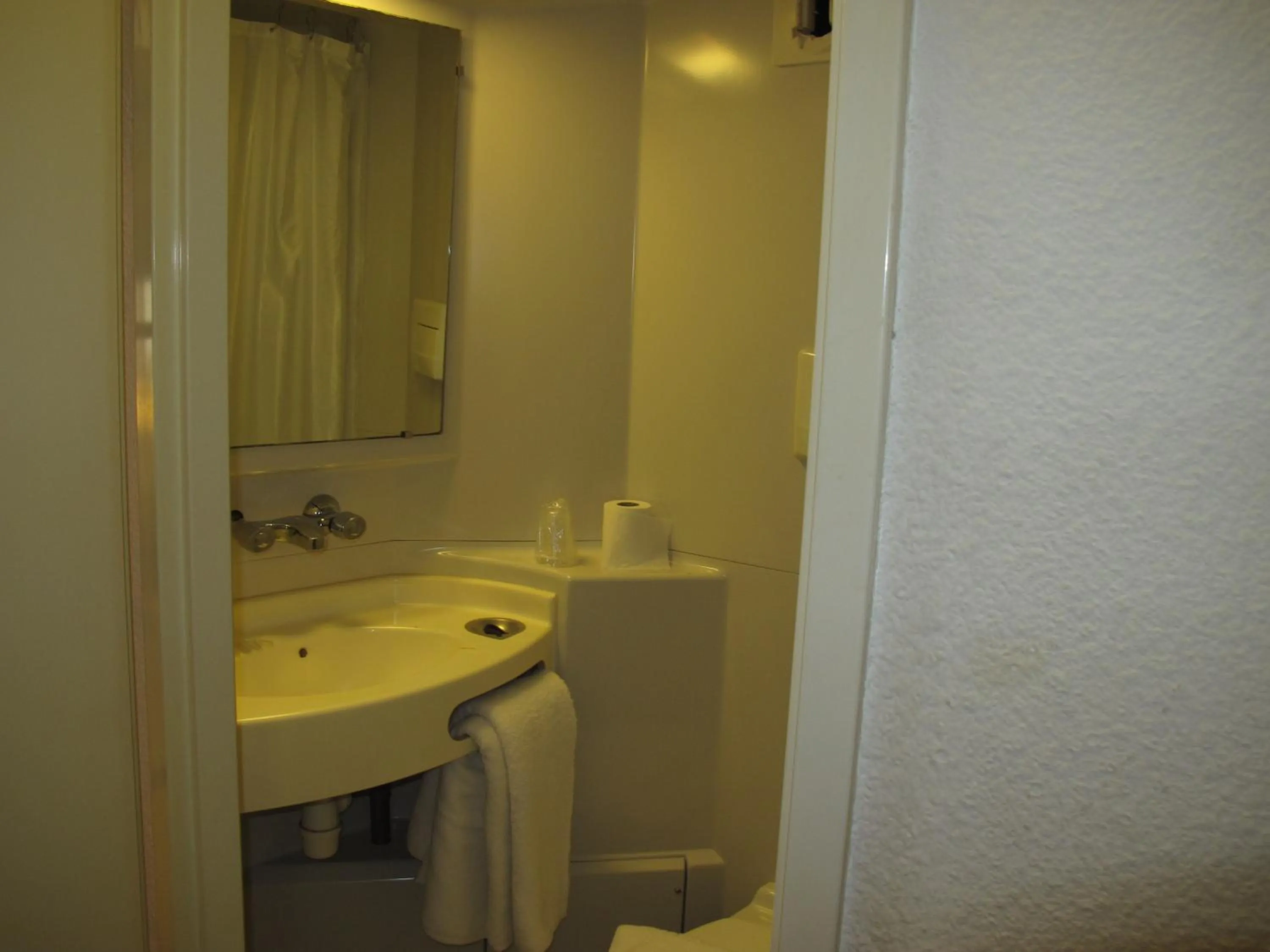 Bathroom in Initial by Balladins Béthune