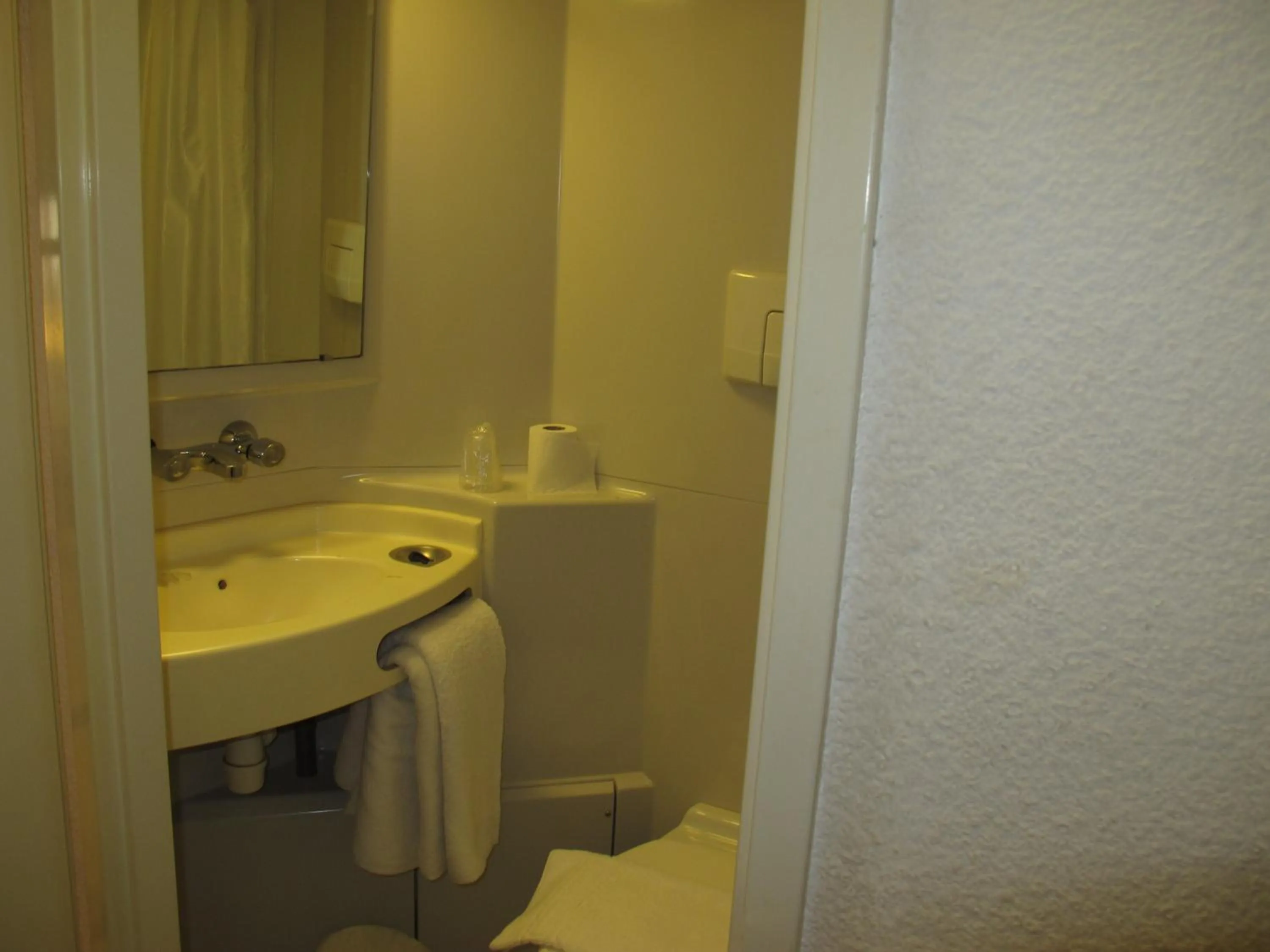 Bathroom in Initial by Balladins Béthune