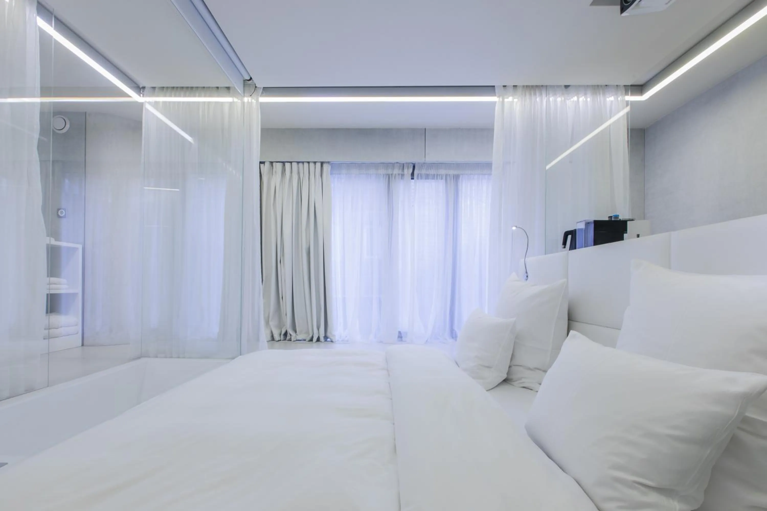 Bed in The Grove Design Hotel