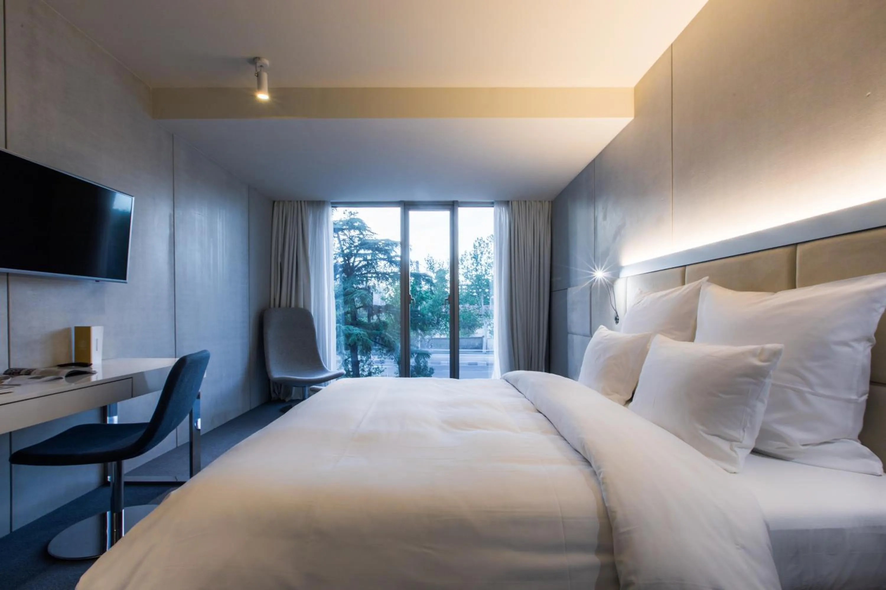 Bed in The Grove Design Hotel