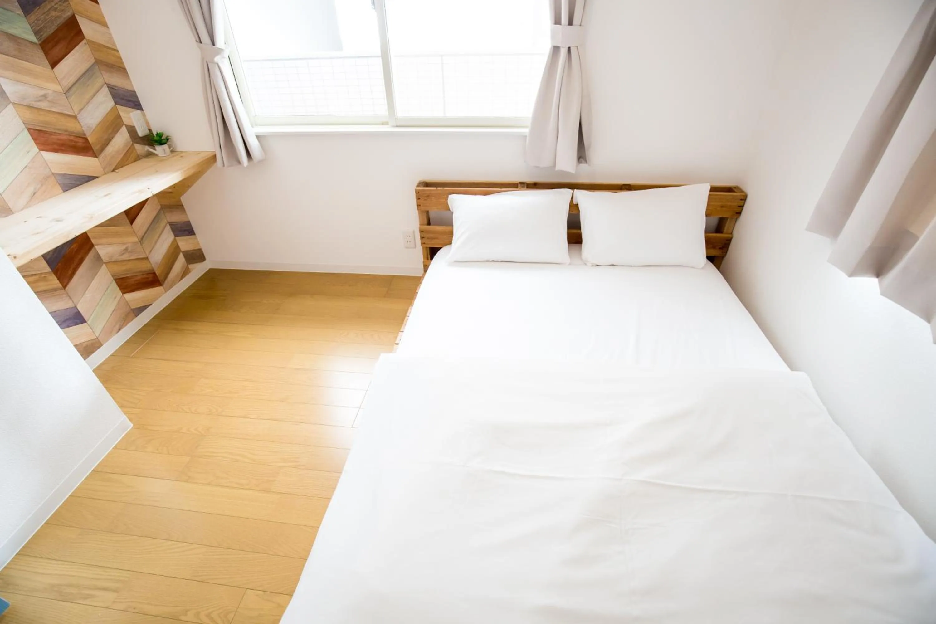 Bed in IZA Enoshima Guest House and Bar