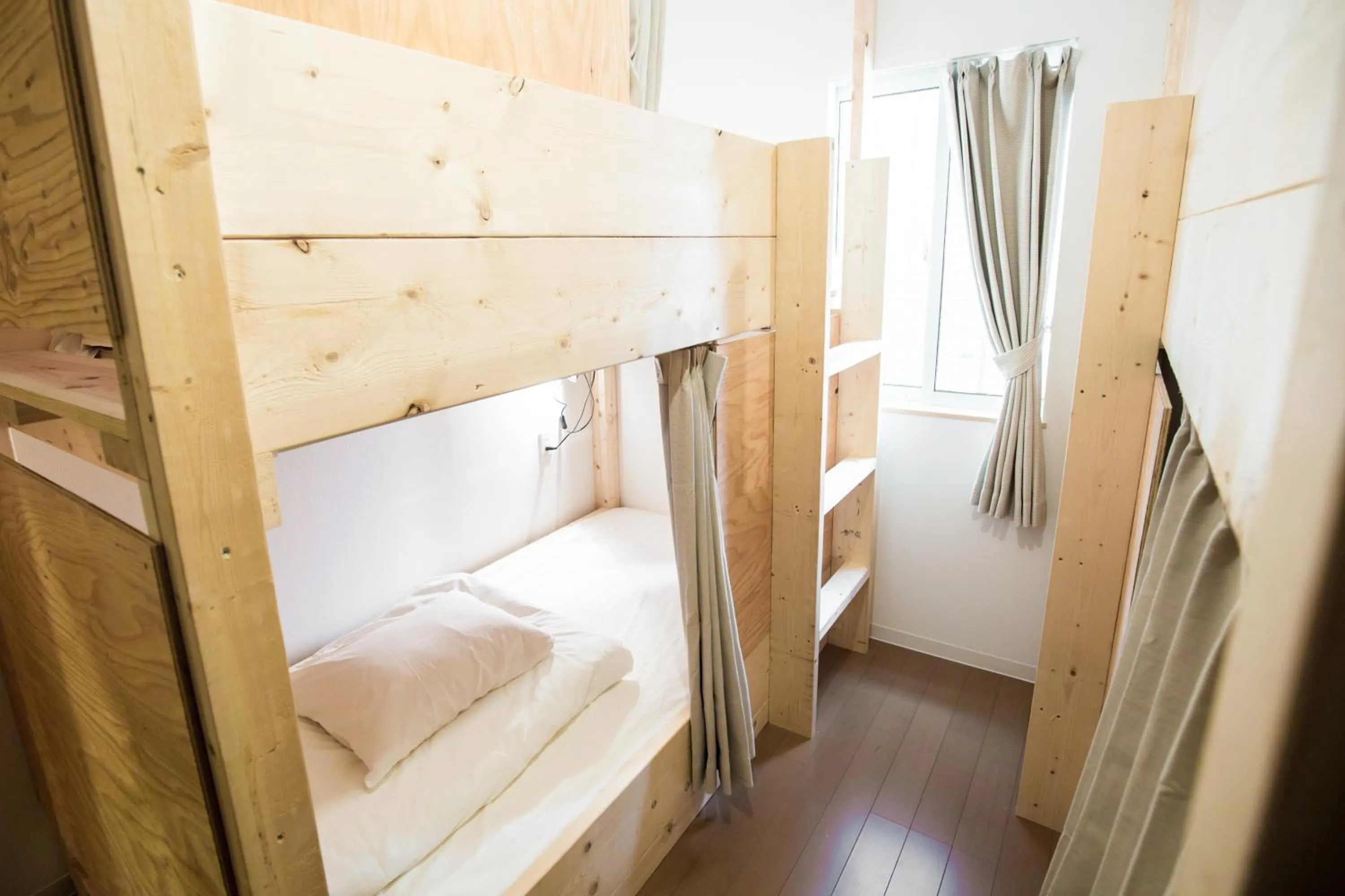 Bed in IZA Enoshima Guest House and Bar