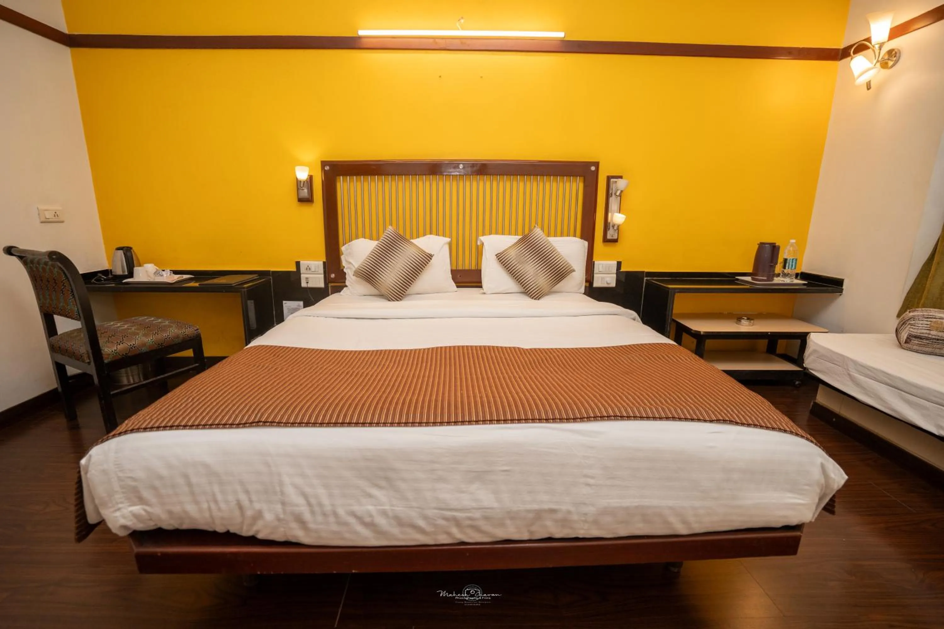 Bed in Hotel Vrishali Executive