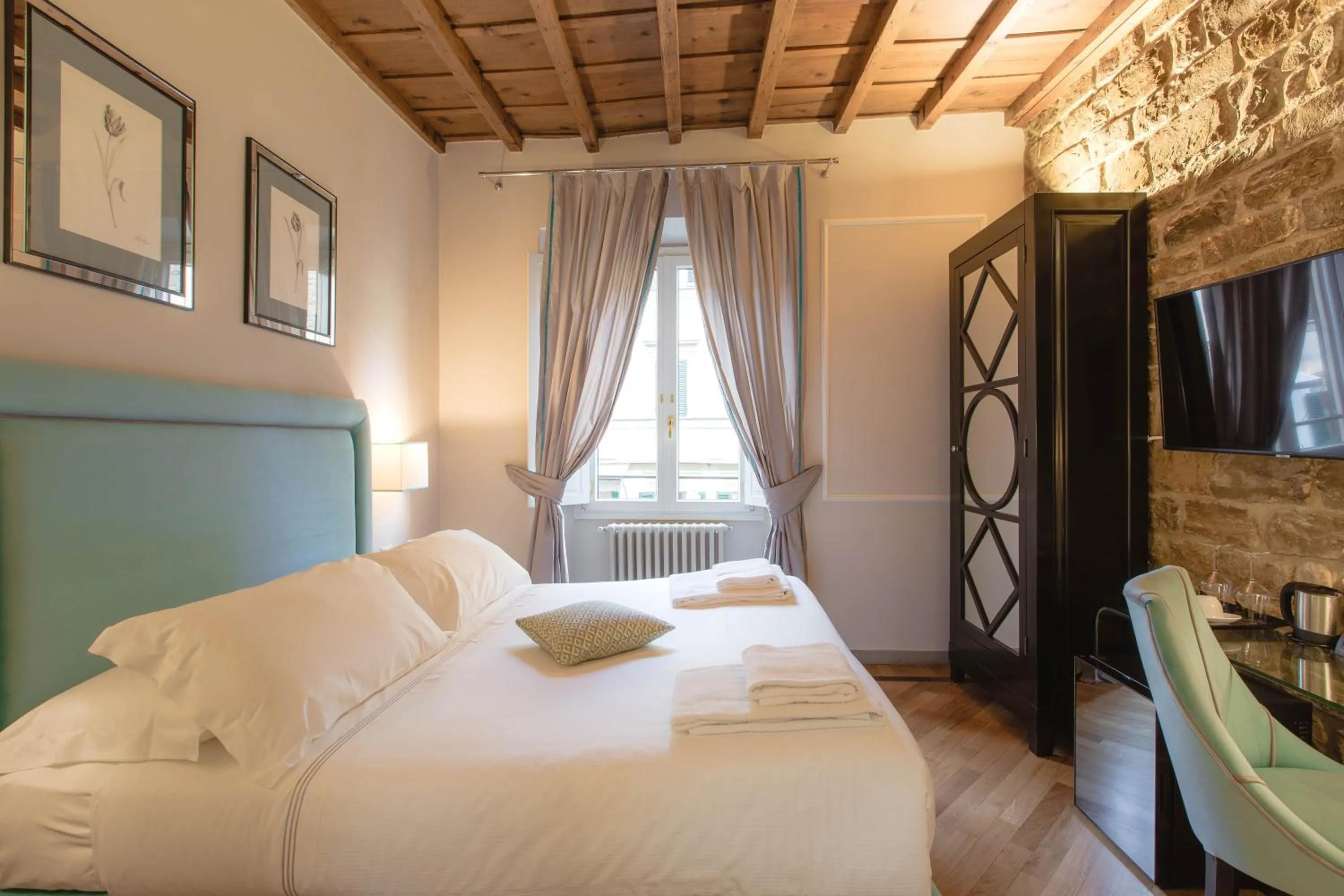 Bed in Relais Tosinghi