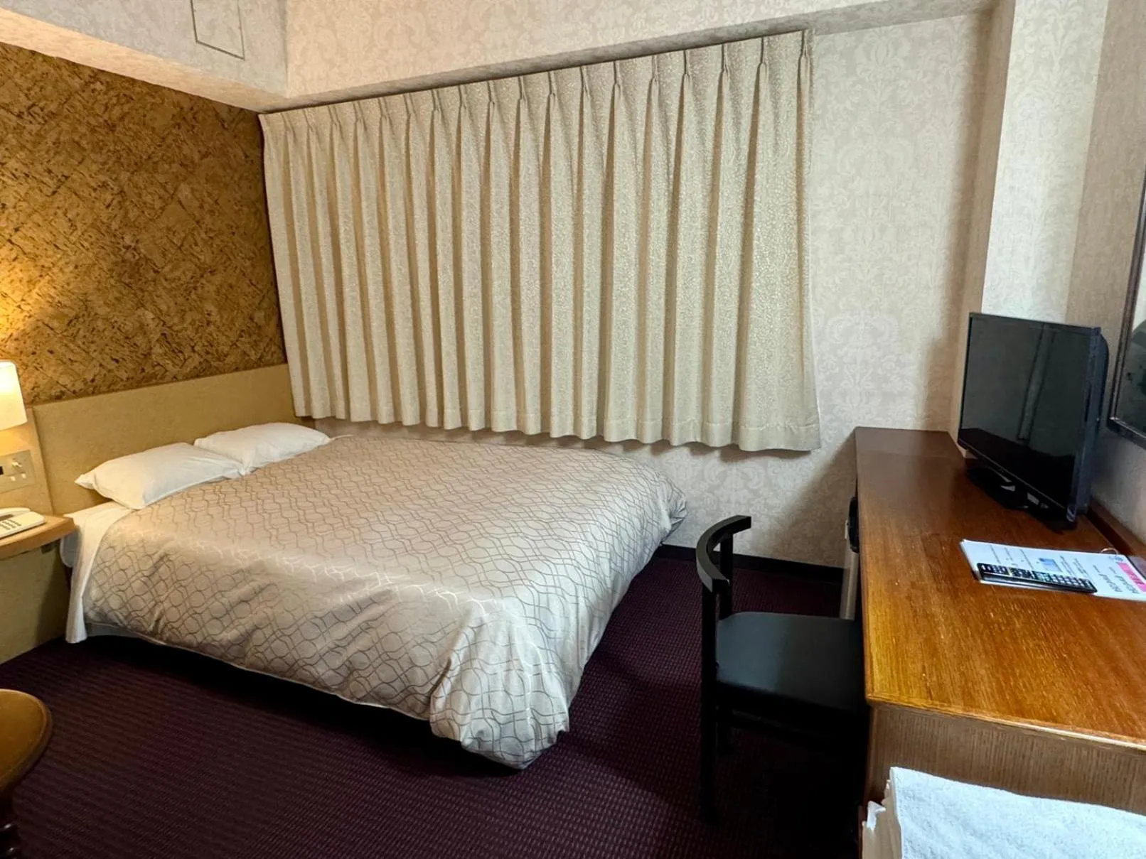 Bed in Ohta Grand Hotel