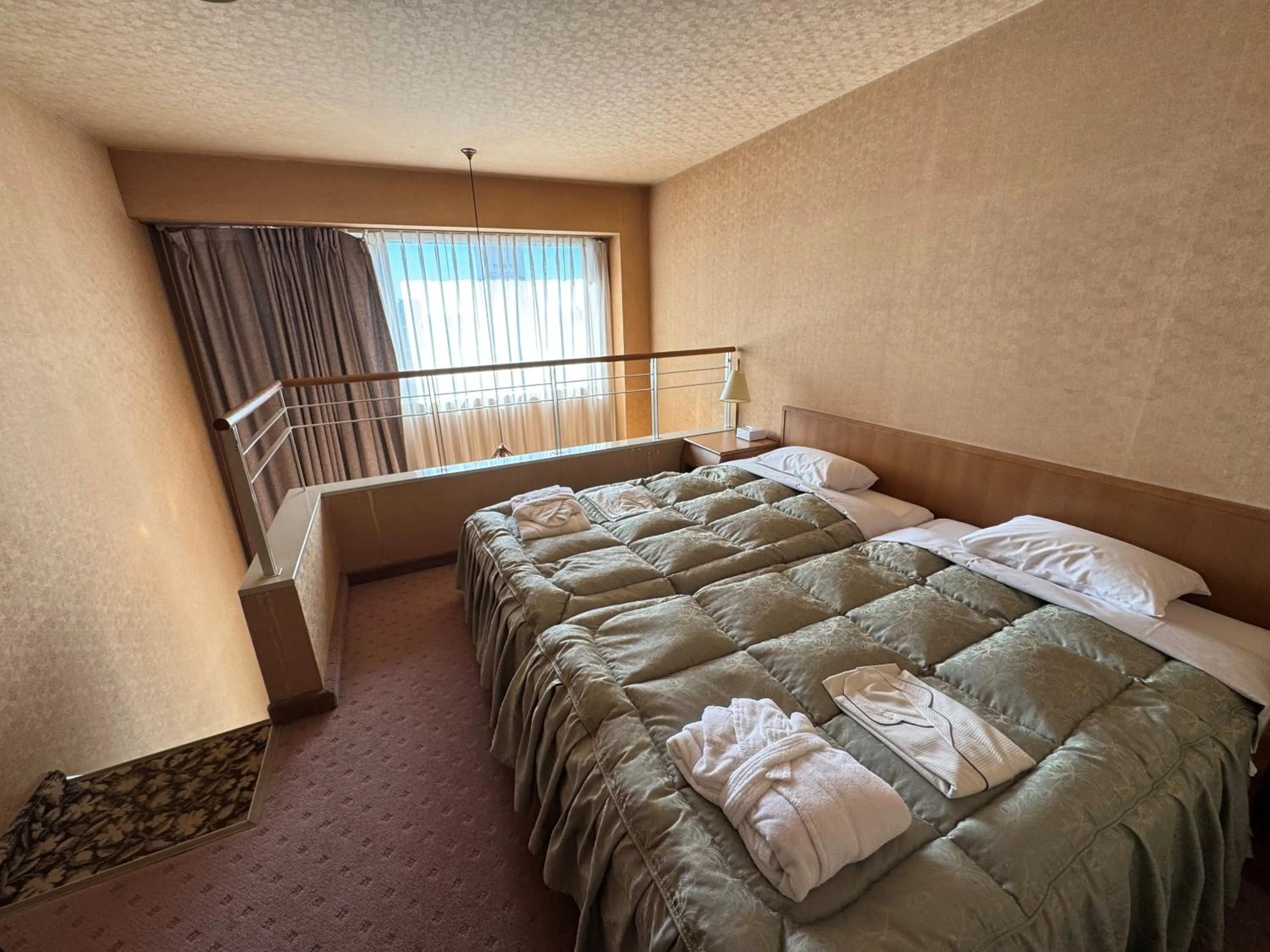 Bed in Ohta Grand Hotel