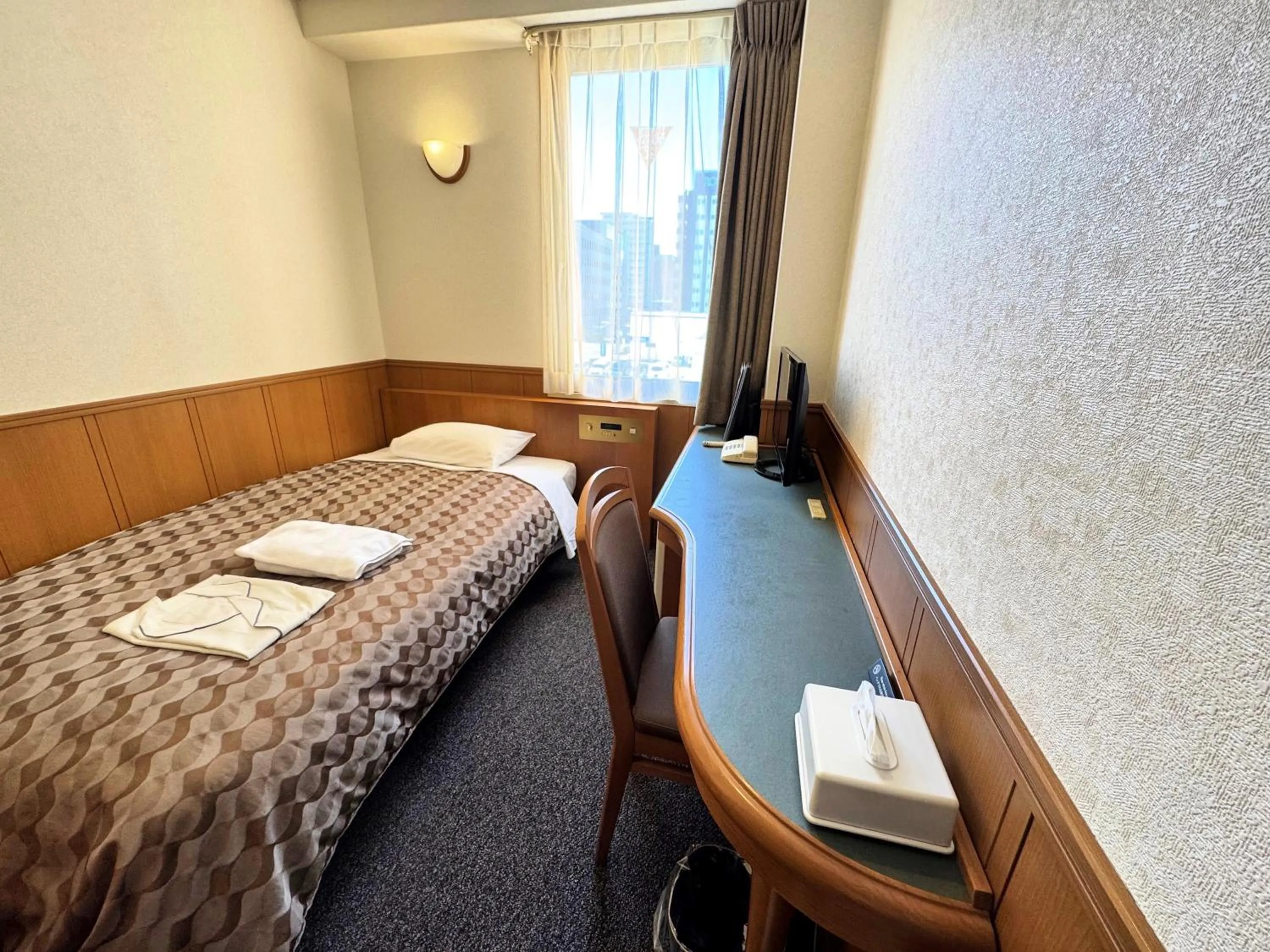 Bed in Ohta Grand Hotel