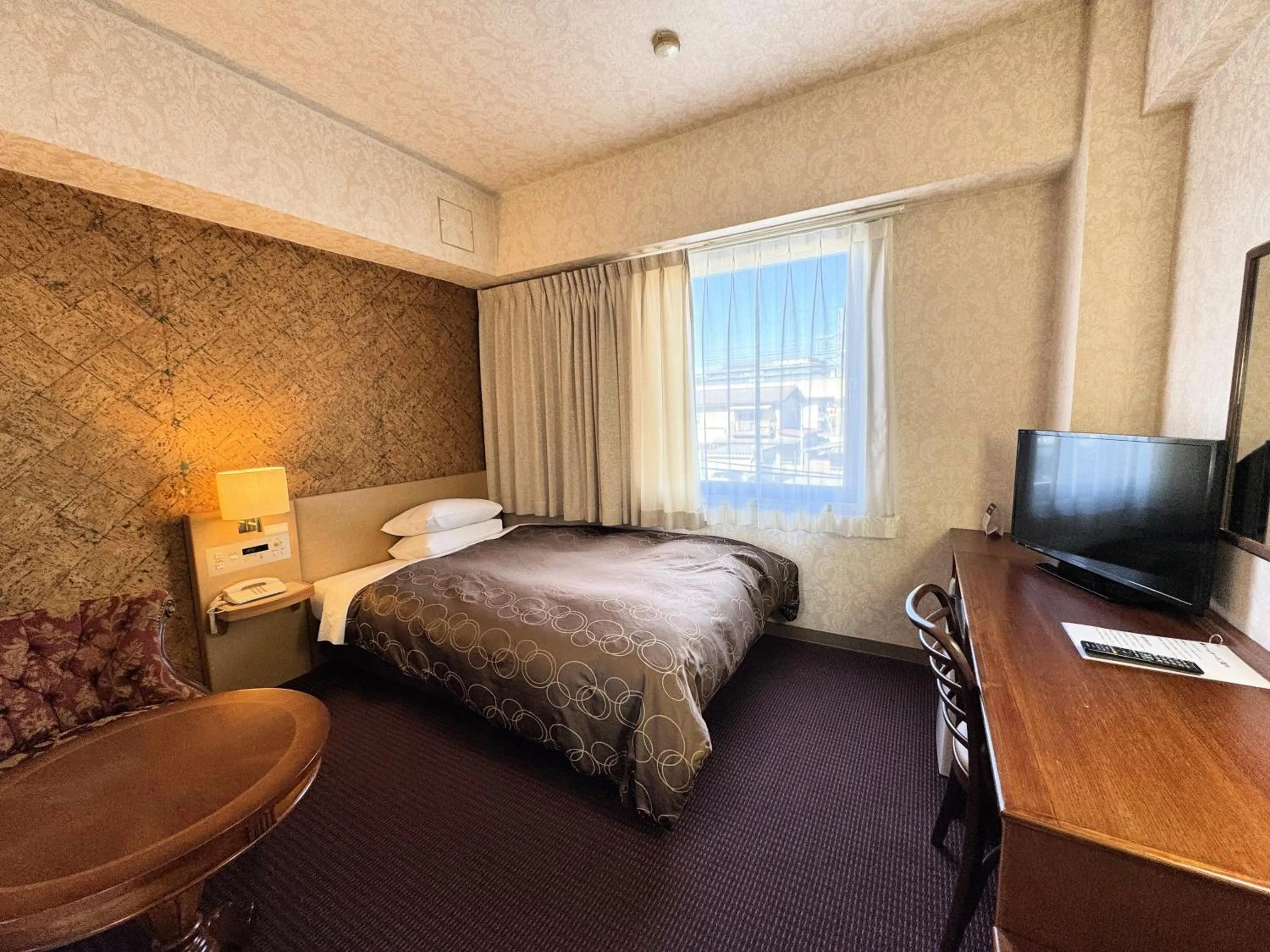 Bed in Ohta Grand Hotel