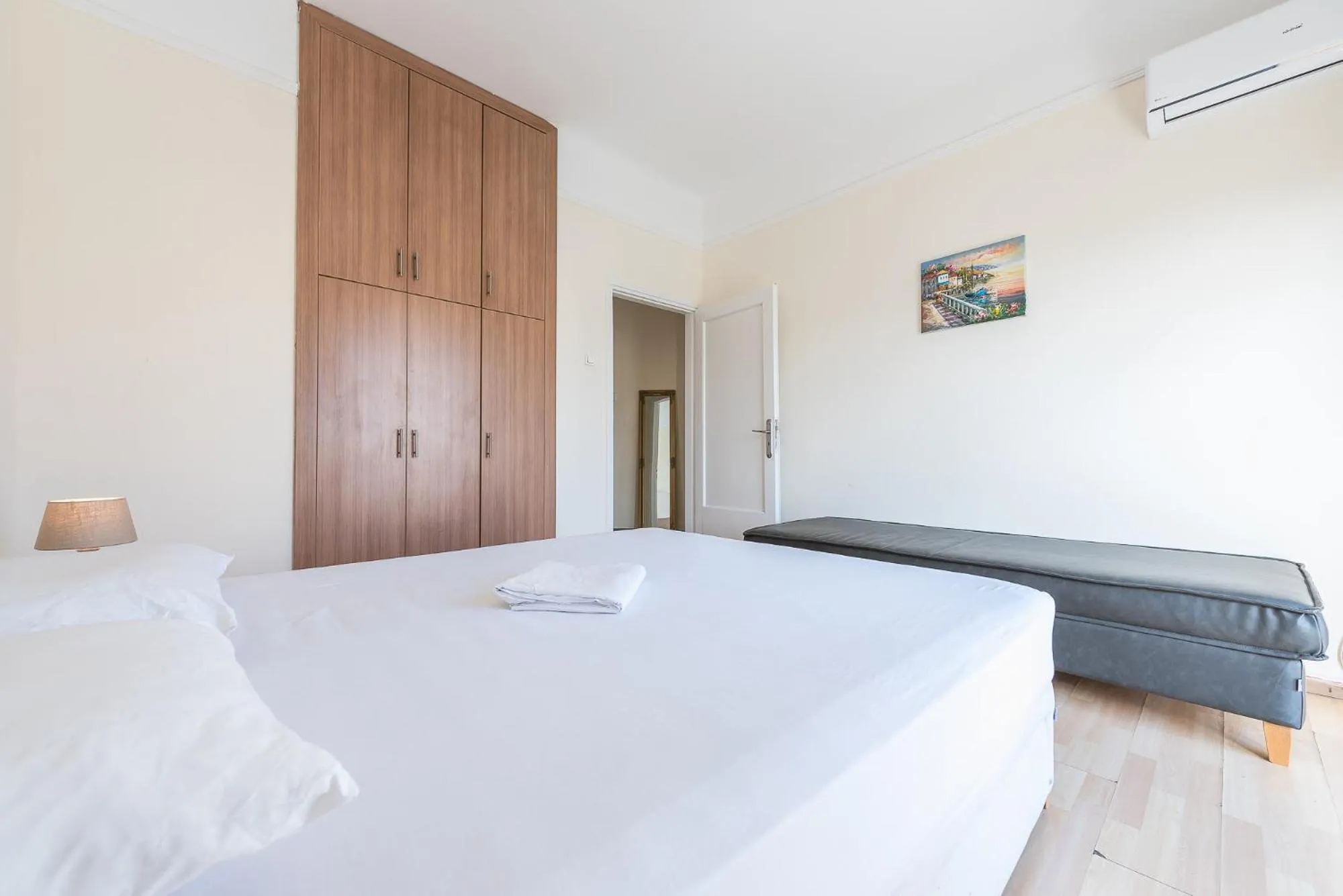 Bed in Super Paradise Apartments