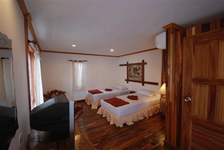 Bed in Tropical Garden Bungalow