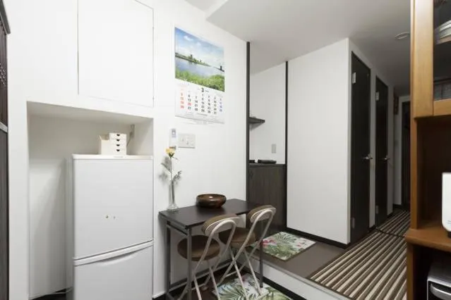 Kitchen or kitchenette in Osaka Nakayama Guesthouse