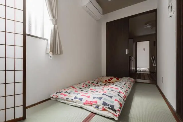 Bed in Osaka Nakayama Guesthouse