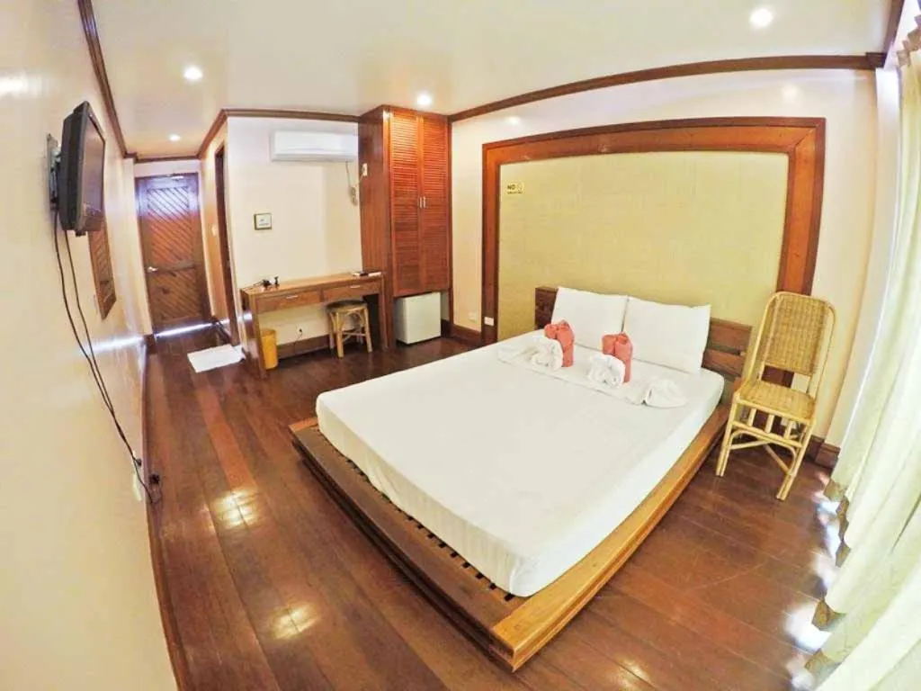 Balcony/Terrace, Bed in El Nido Beach Hotel