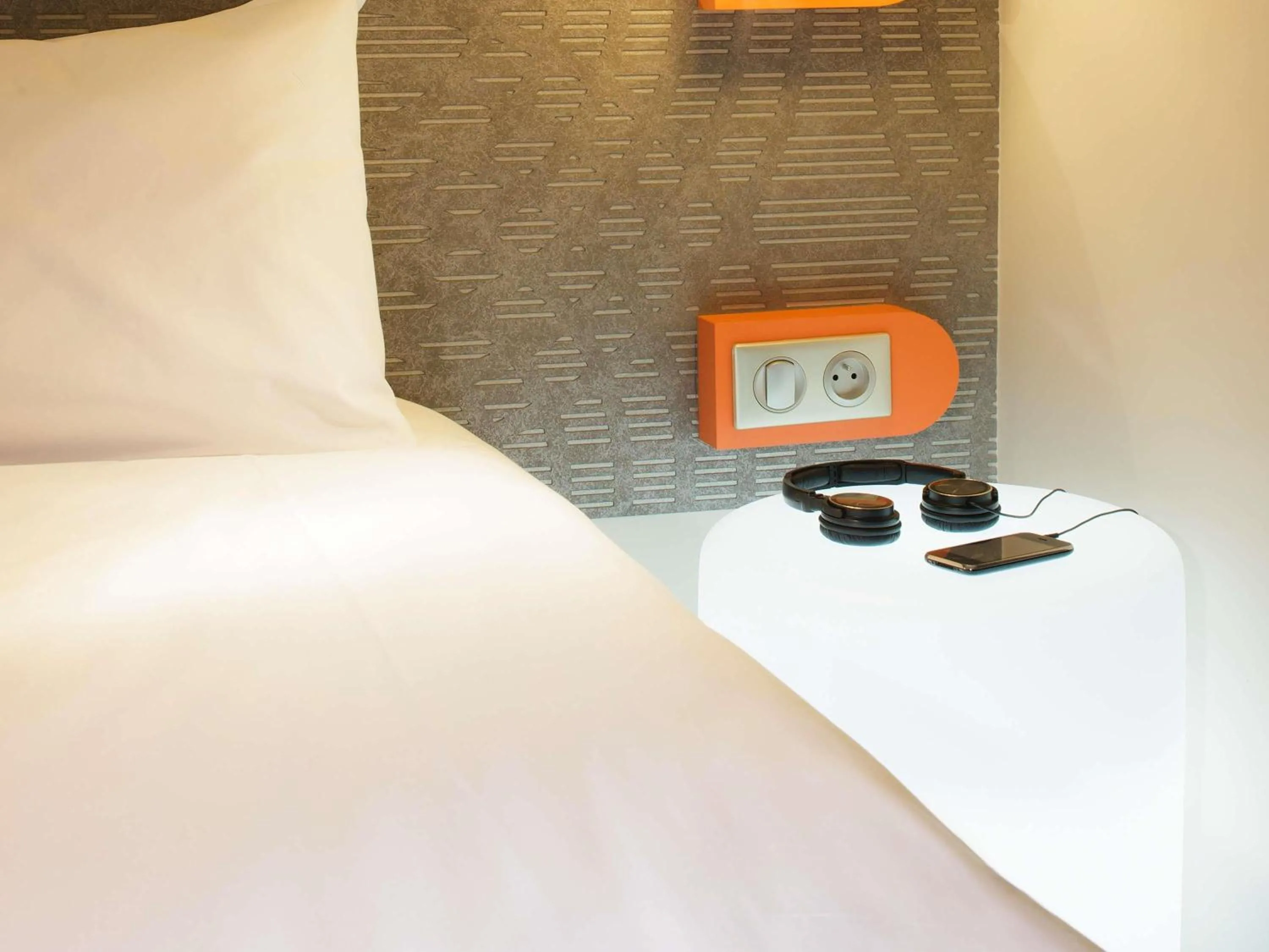 Bedroom in ibis Styles Tours Centre