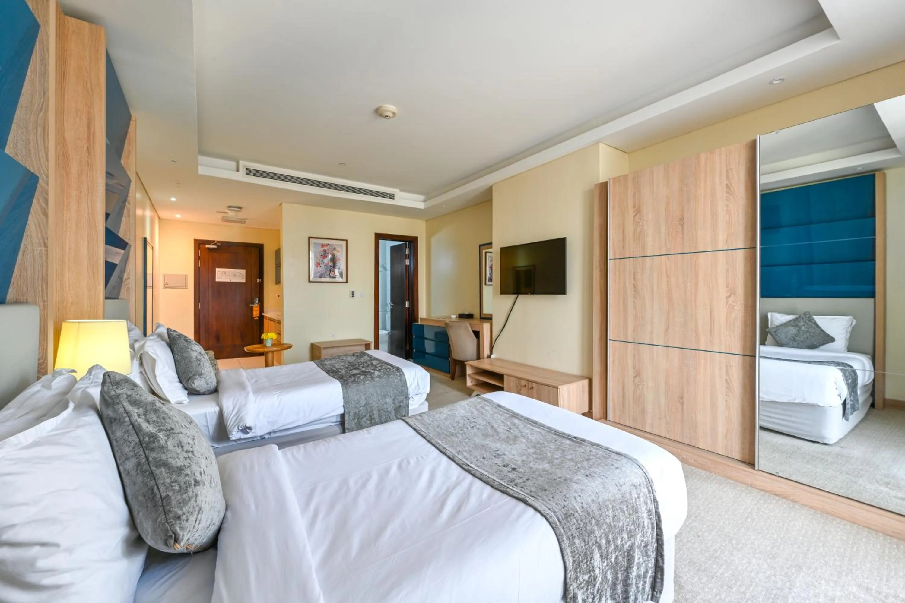 Bed in Al Mansour Suites Hotel