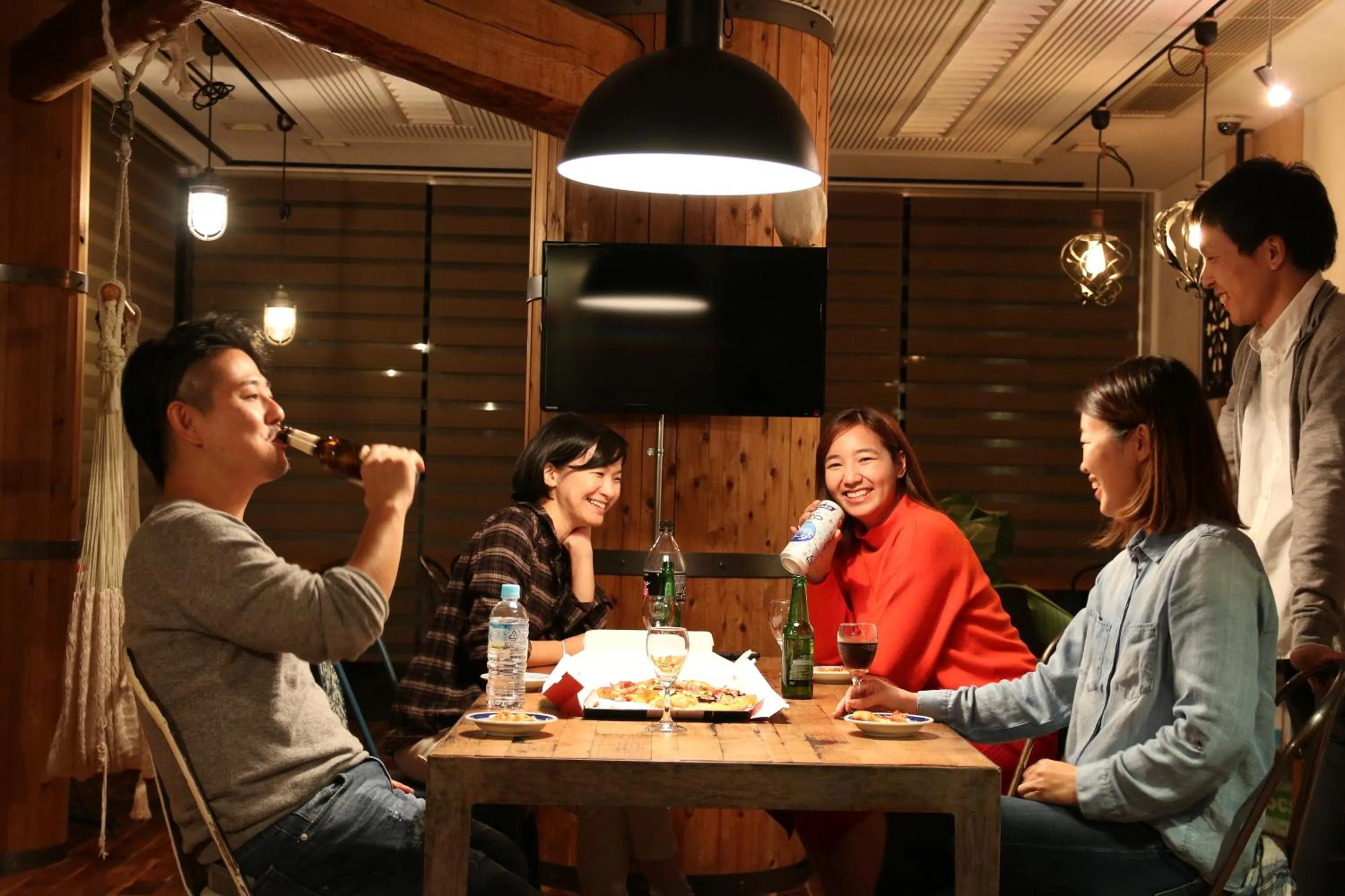 Communal lounge/ TV room in 365BASE outdoor hostel