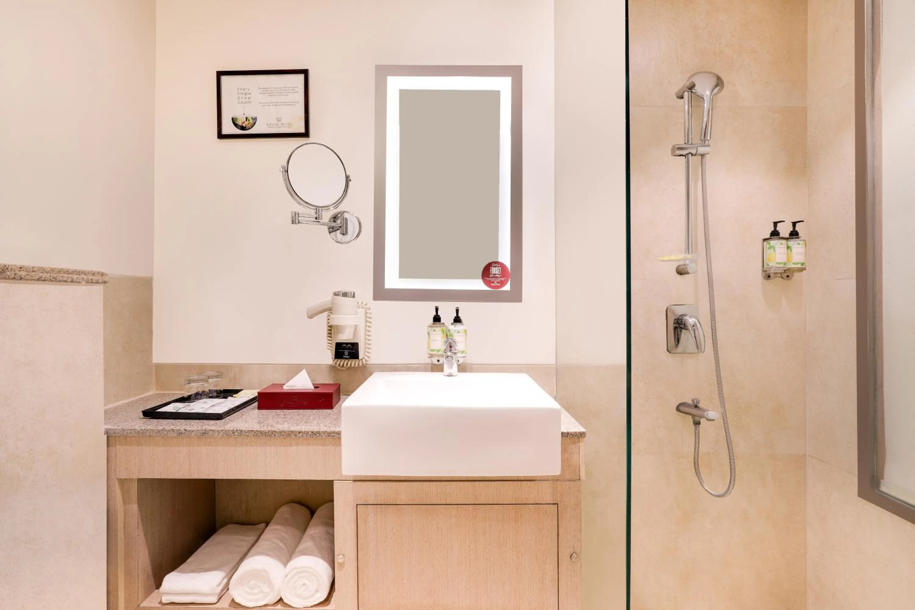 Bathroom in Sandal Suites by Lemon Tree Hotels
