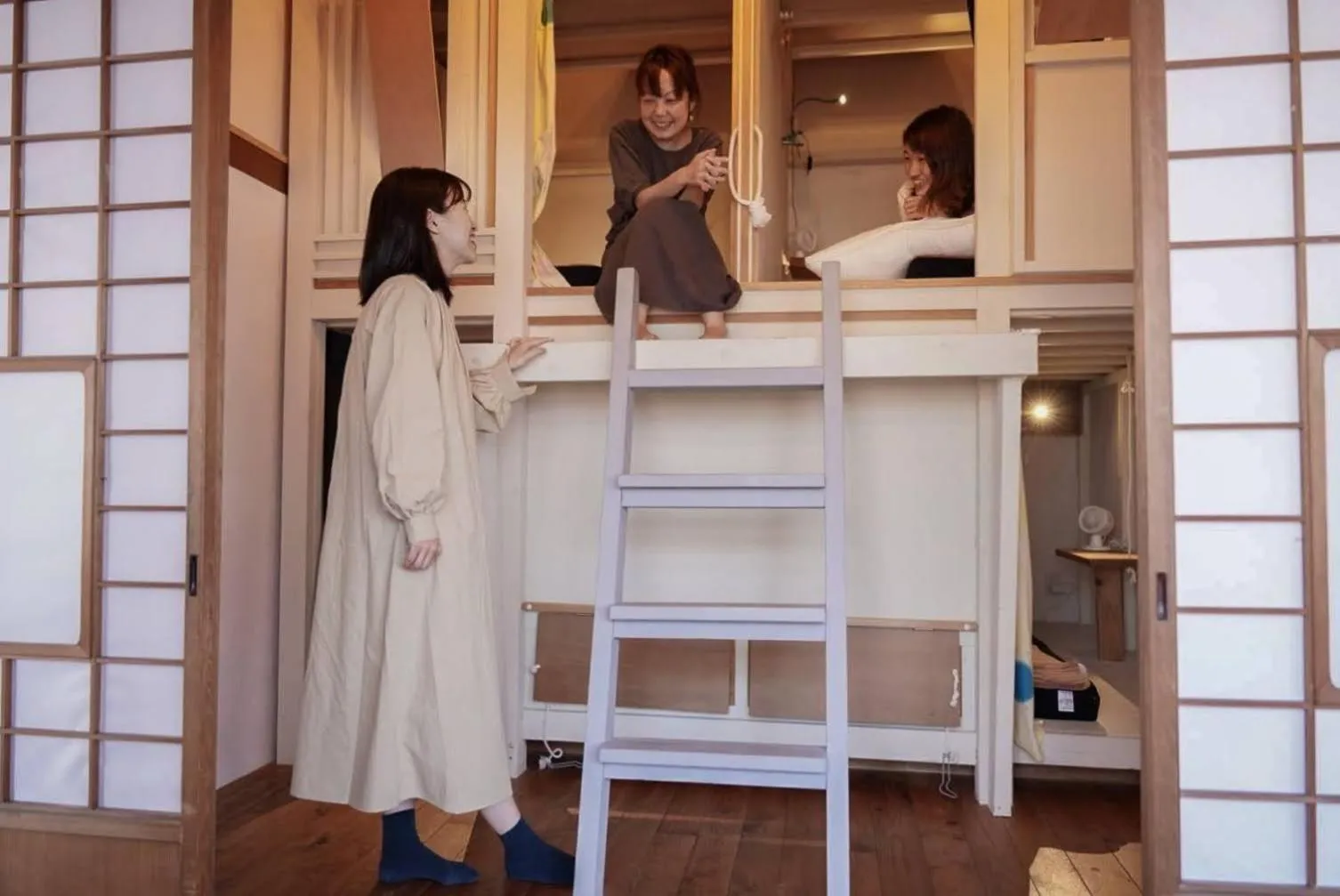 People in Taketa Ekimae Hostel cue