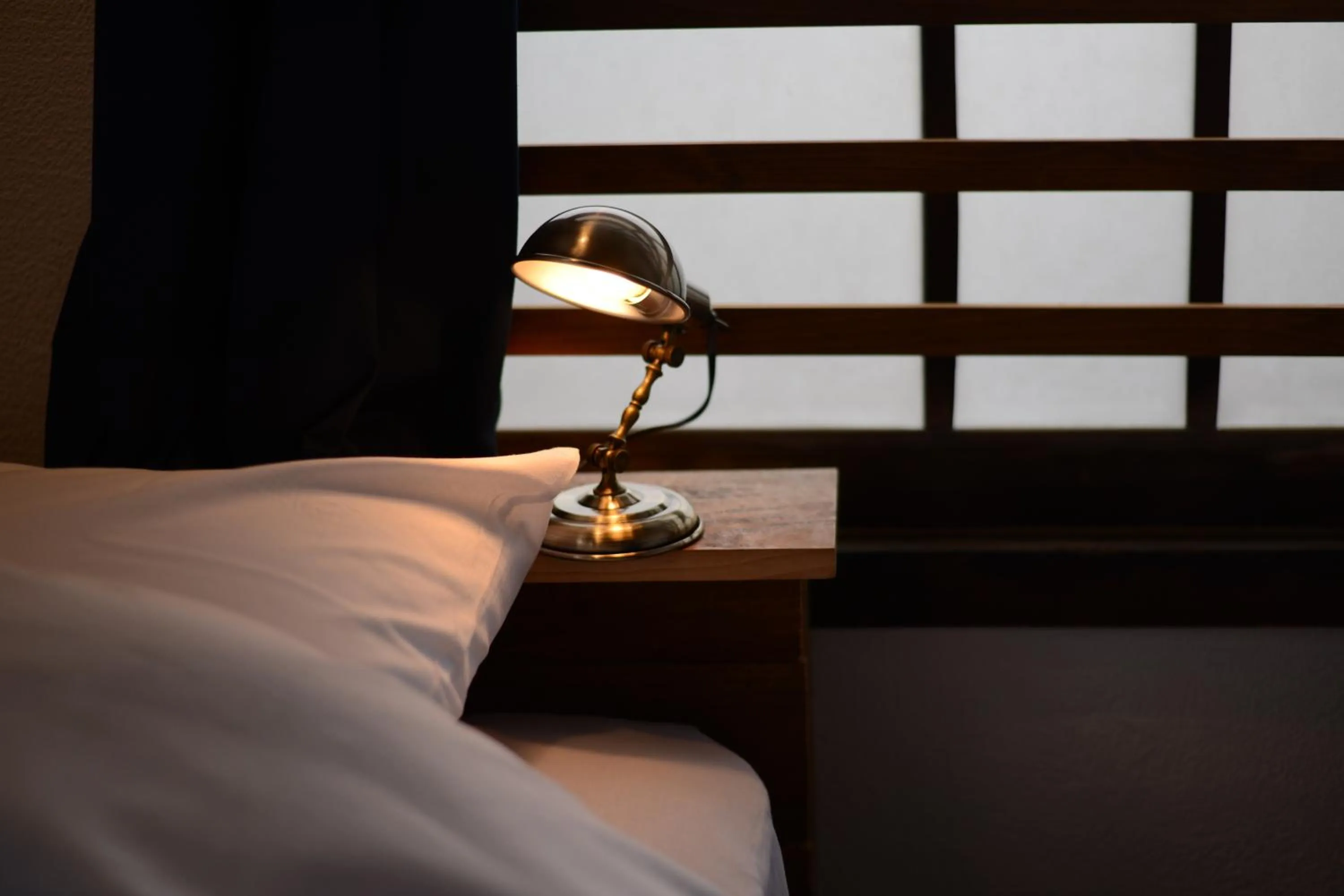 Decorative detail, Bed in Taketa Ekimae Hostel cue