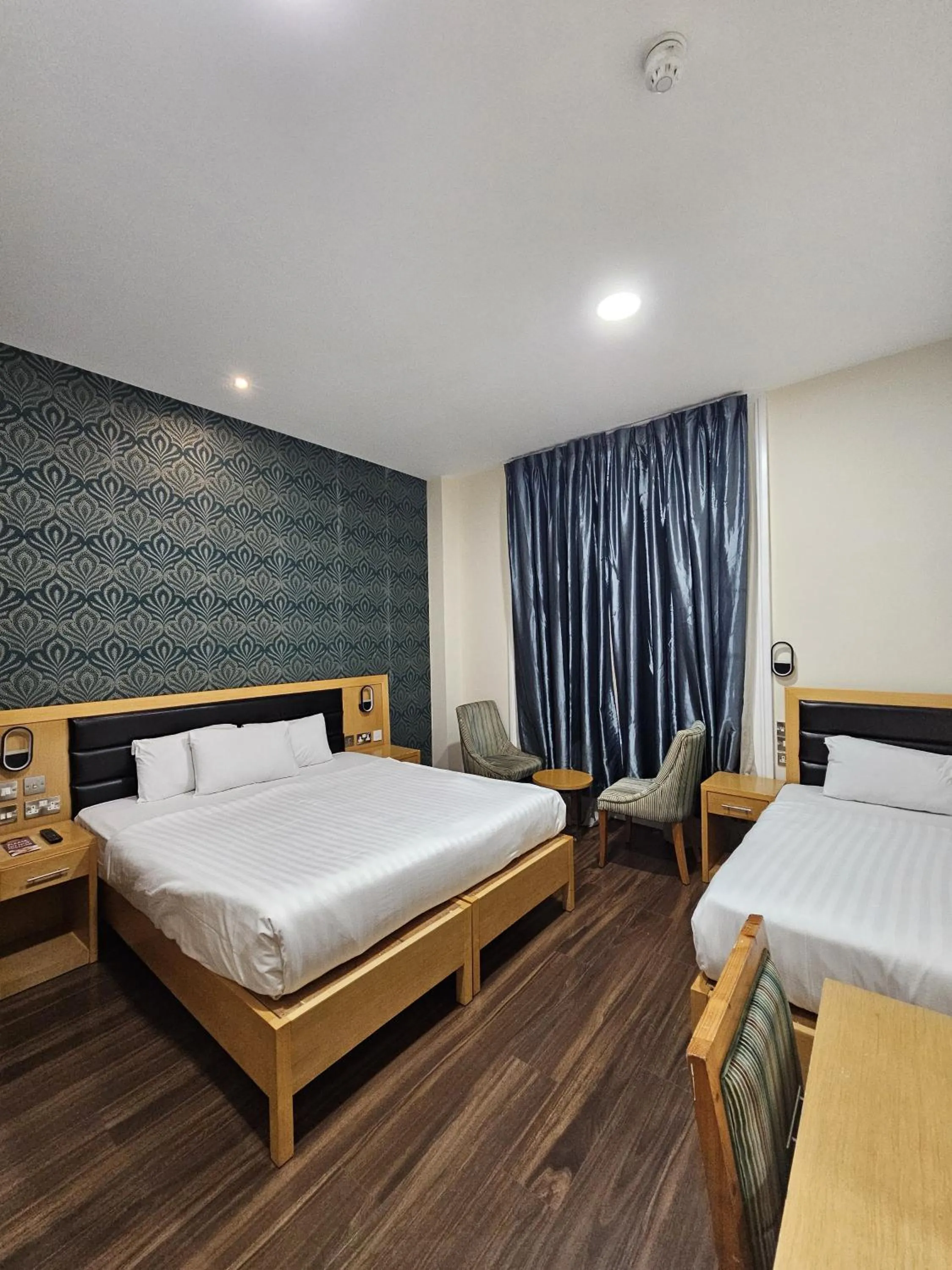 Bed in Cromwell Hotel