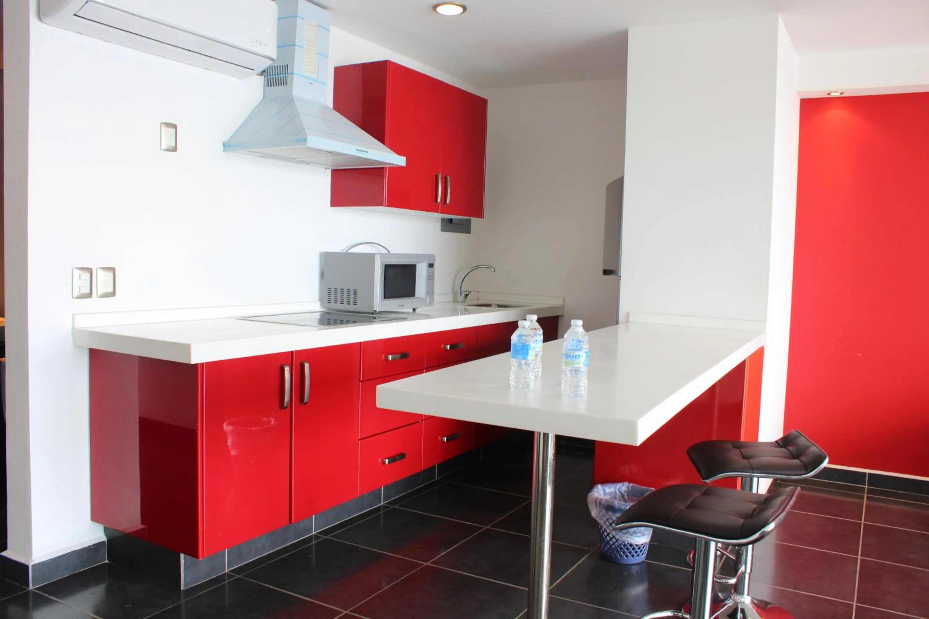 Kitchen or kitchenette in Ramada by Wyndham Acapulco Hotel & Suites