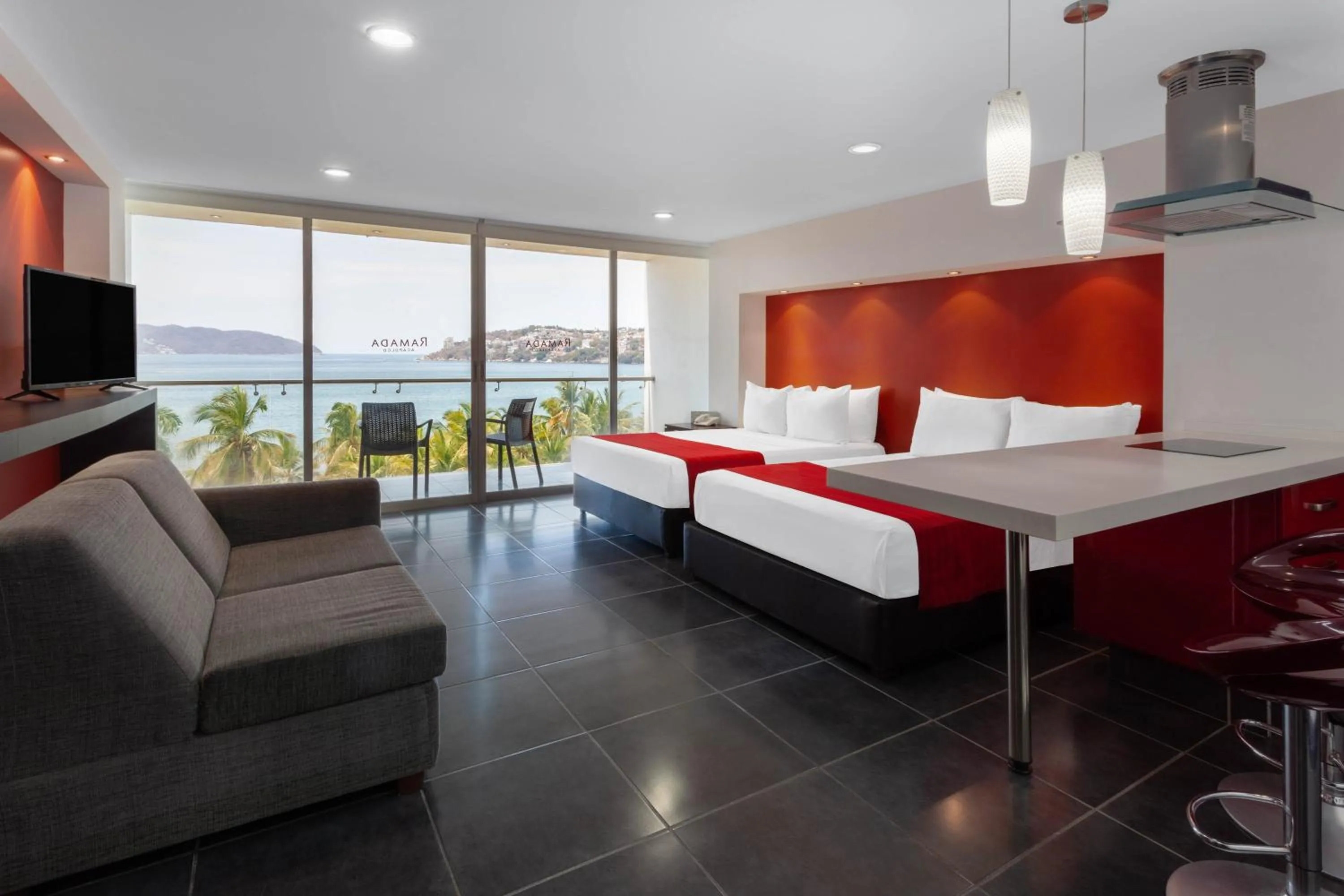 Photo of the whole room, Bed in Ramada by Wyndham Acapulco Hotel & Suites