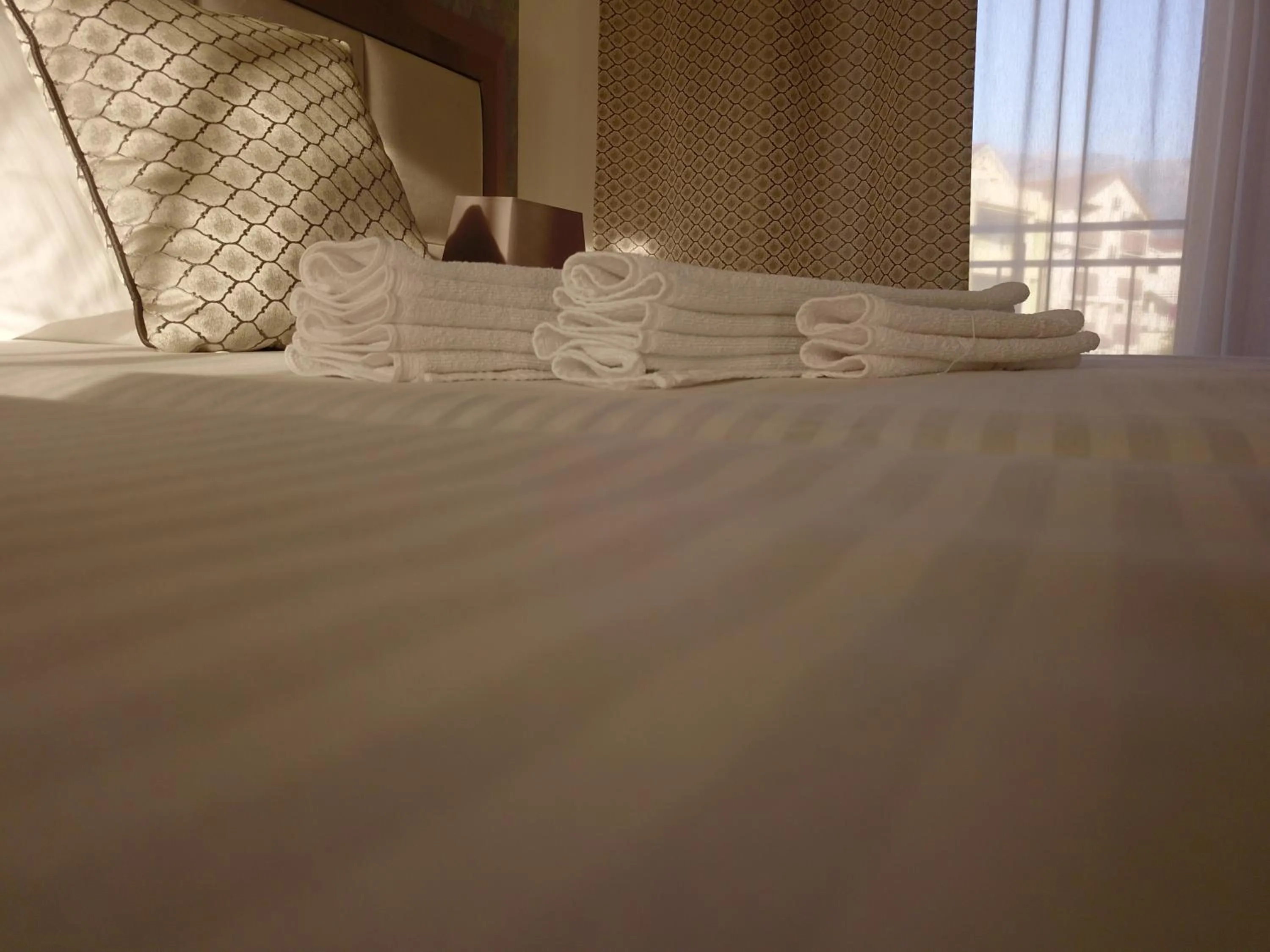 Bed in Villa Royal Apartments