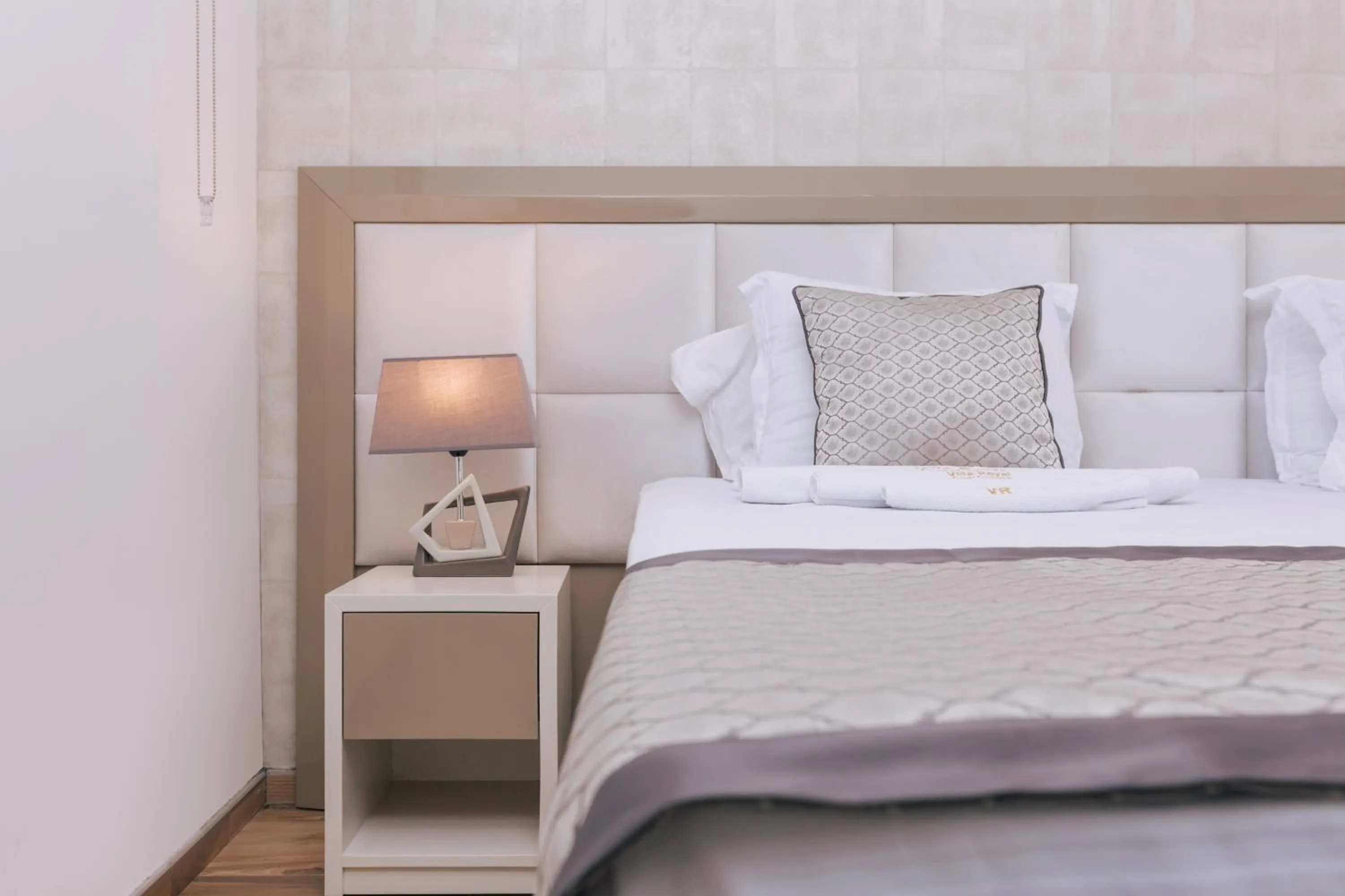 Bed in Villa Royal Apartments