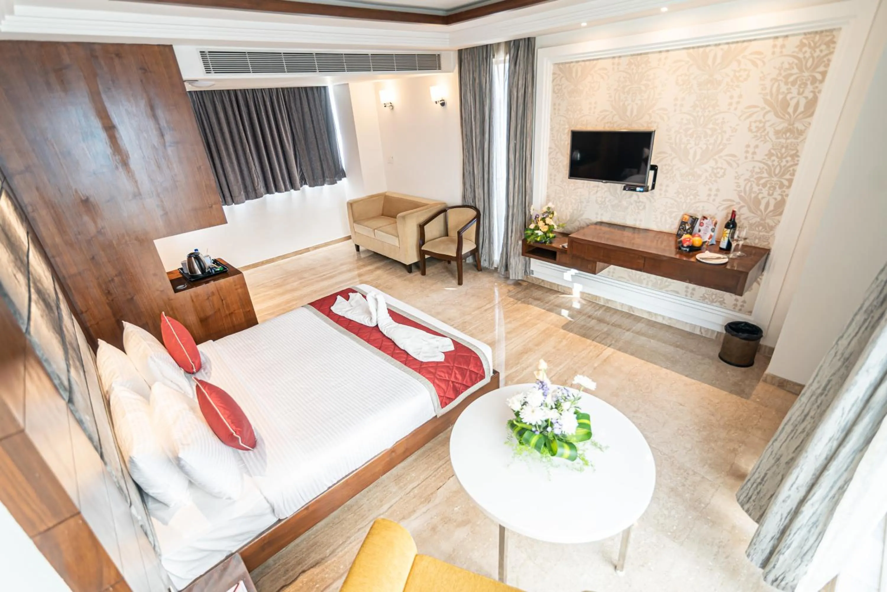 Communal lounge/ TV room, Bed in Bhagini Icon Premier Hotel