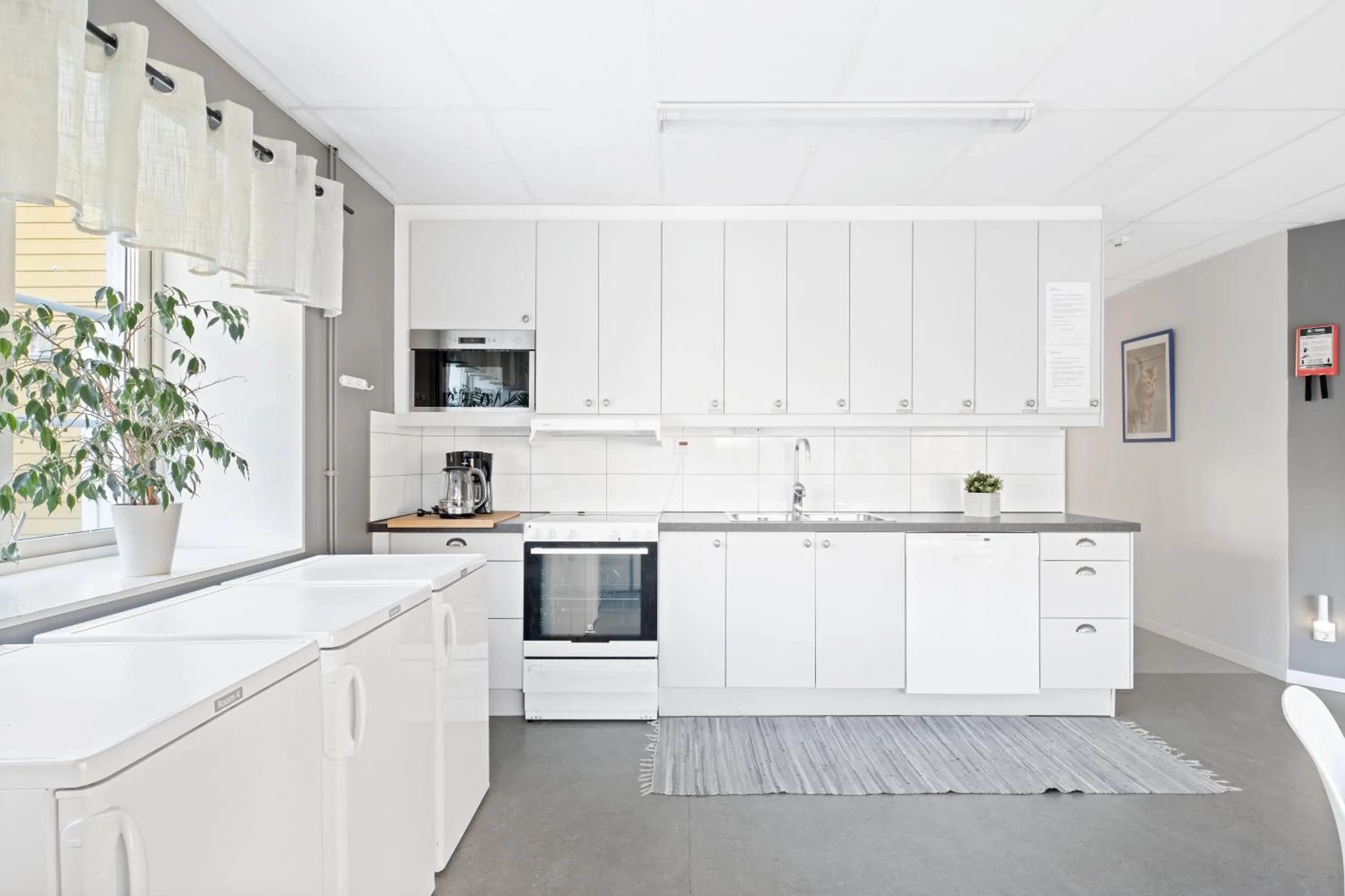 Communal kitchen in Uppsala Lägenhetshotell