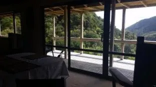 Bed in Waiotemarama Falls Lodge