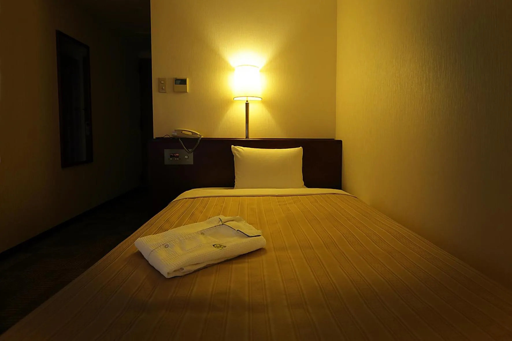 Bed in Kumegawa Wing Hotel