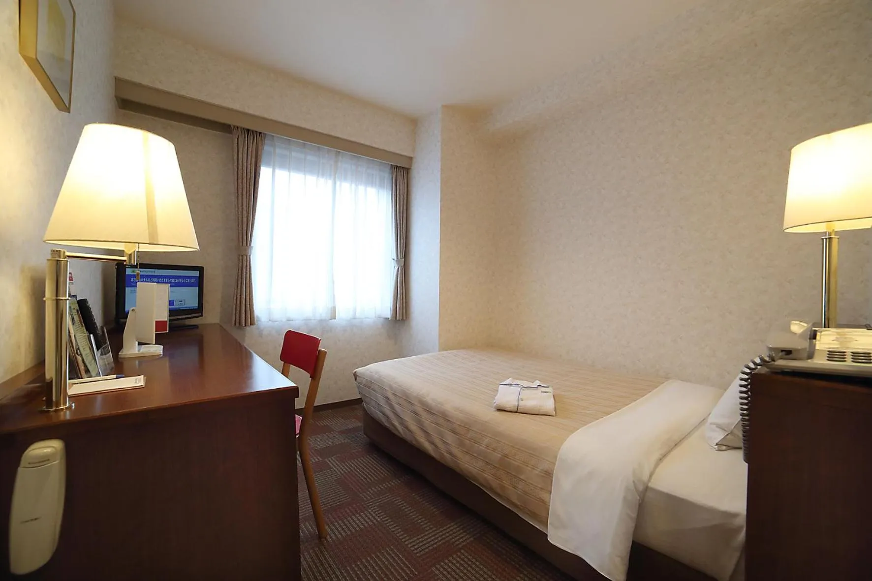 Bed in Kumegawa Wing Hotel