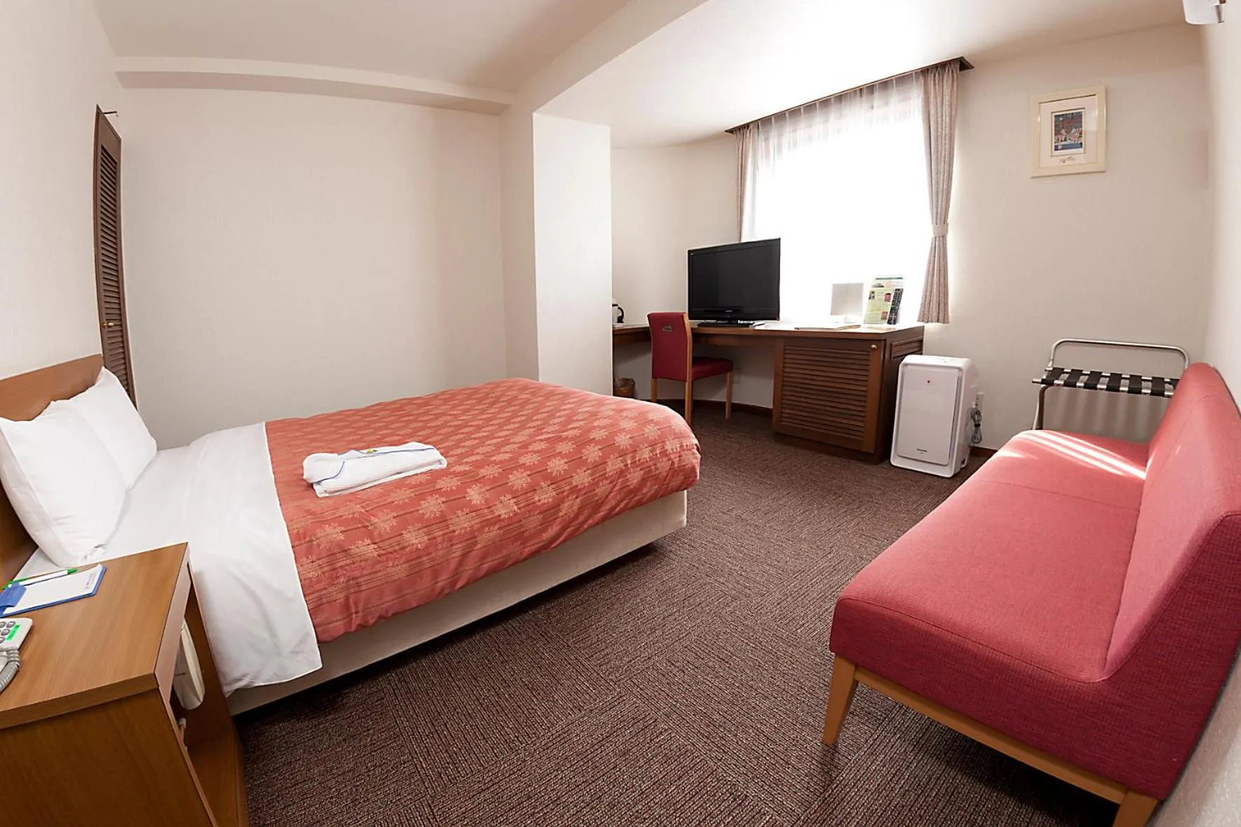 Bed in Kumegawa Wing Hotel