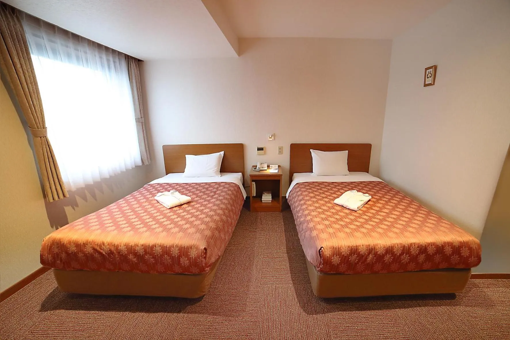 Bed in Kumegawa Wing Hotel