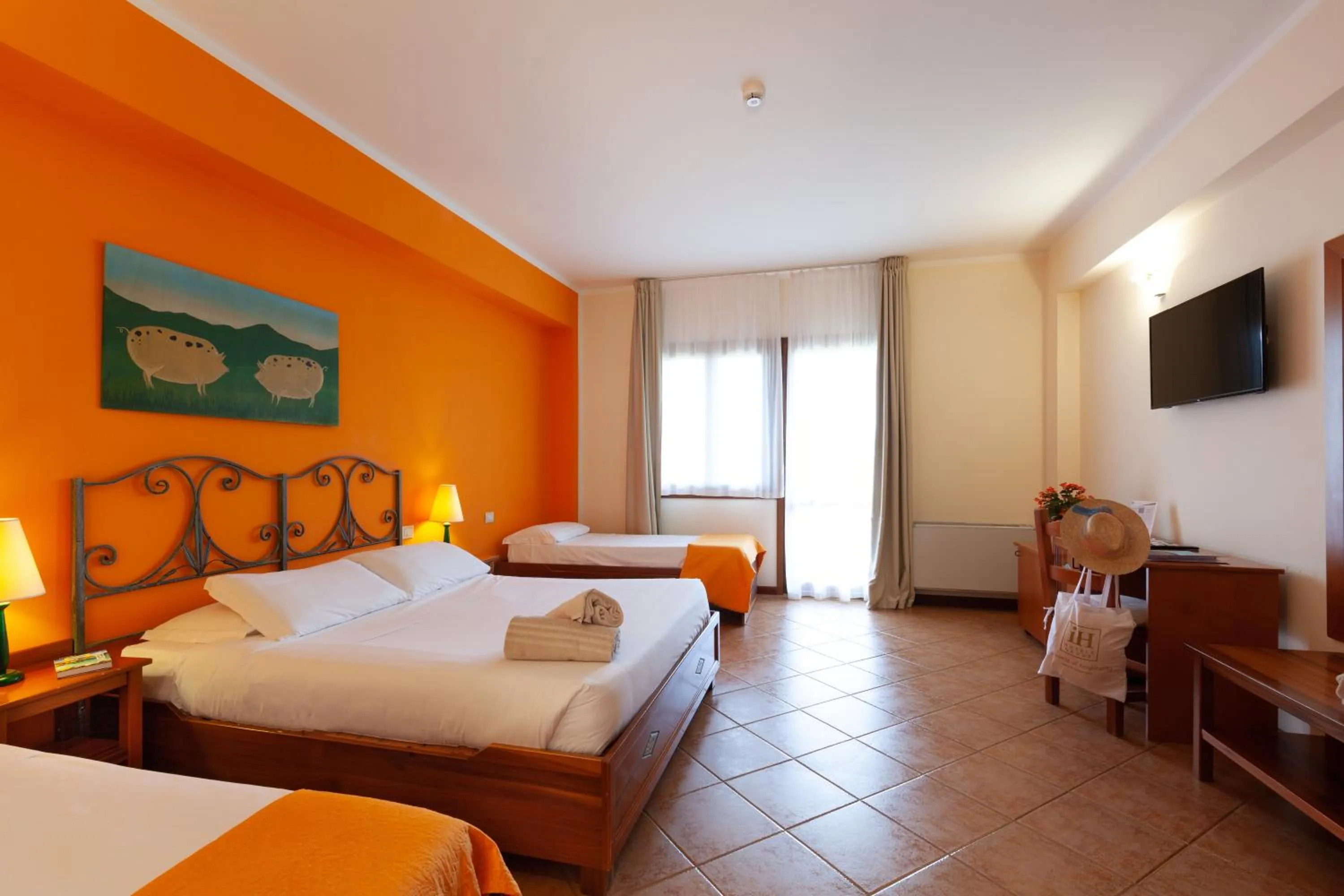 Bed in iH Hotels Le Zagare Resort