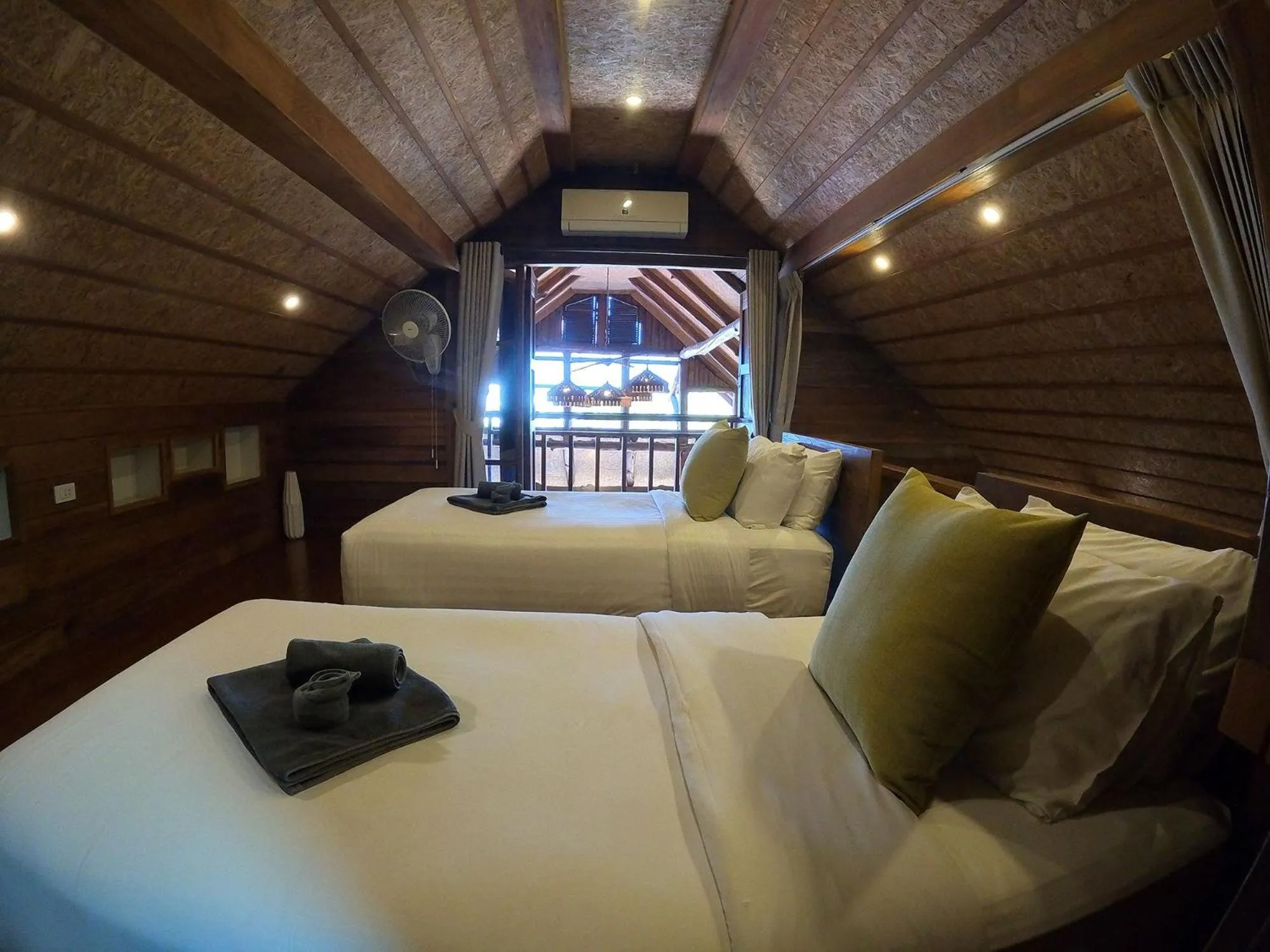 Bed in Tolani Riverside Villa