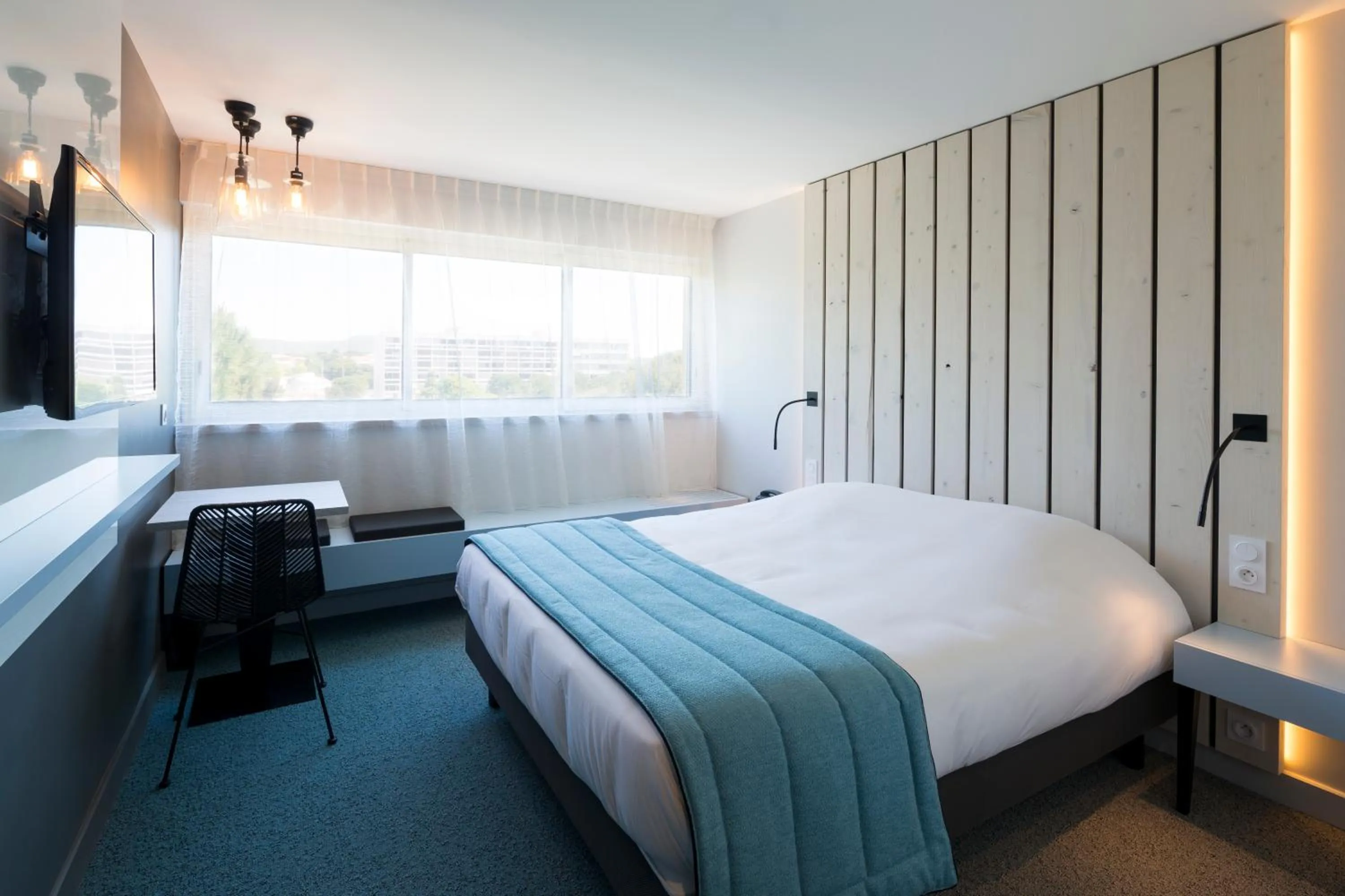 Photo of the whole room, Bed in Logis Hôtel Les Pins - Opéralia