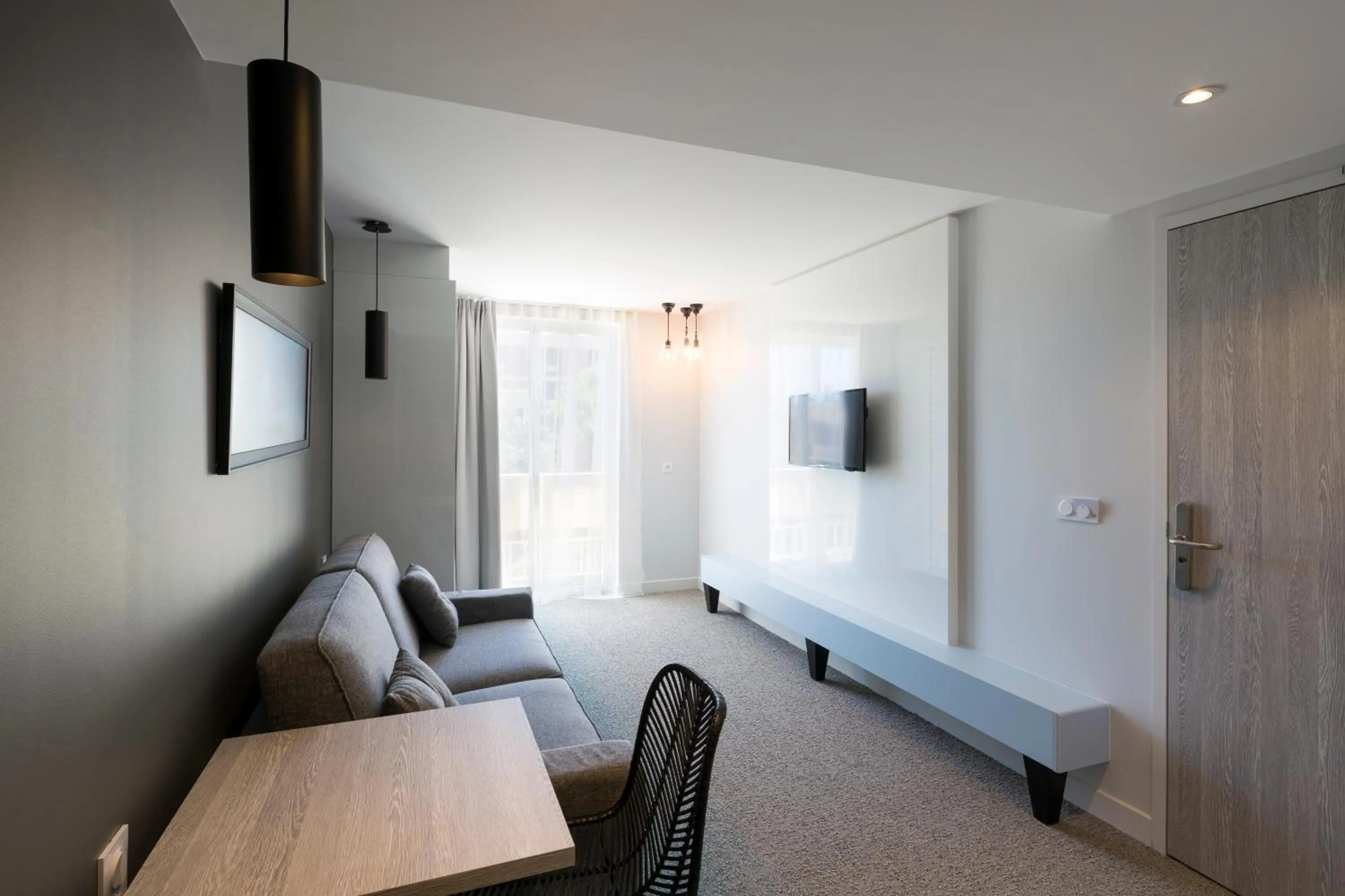 Bed in Logis Hôtel Les Pins - Opéralia