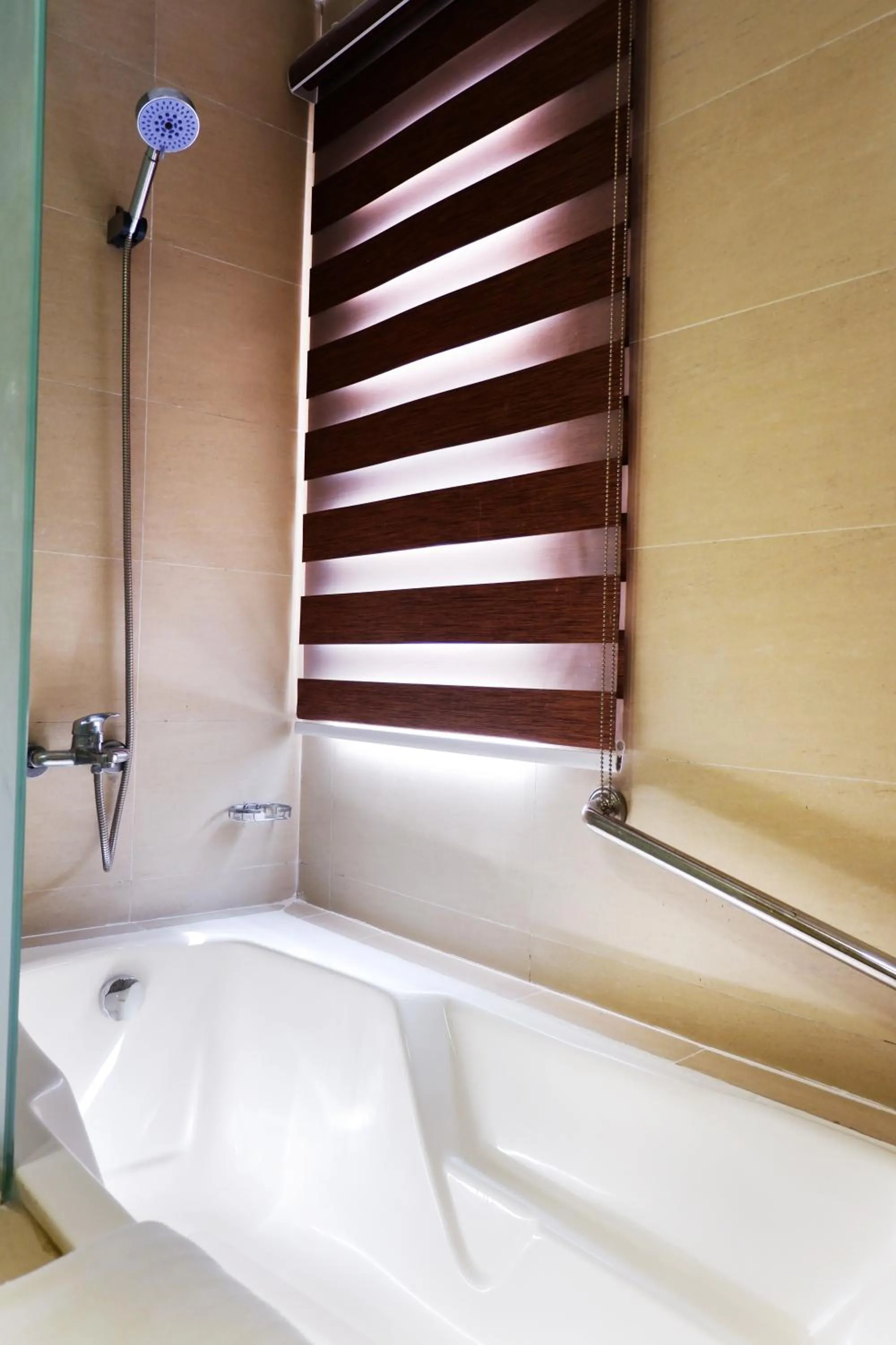 Shower in Valero Grand Suites by Swiss-Belhotel