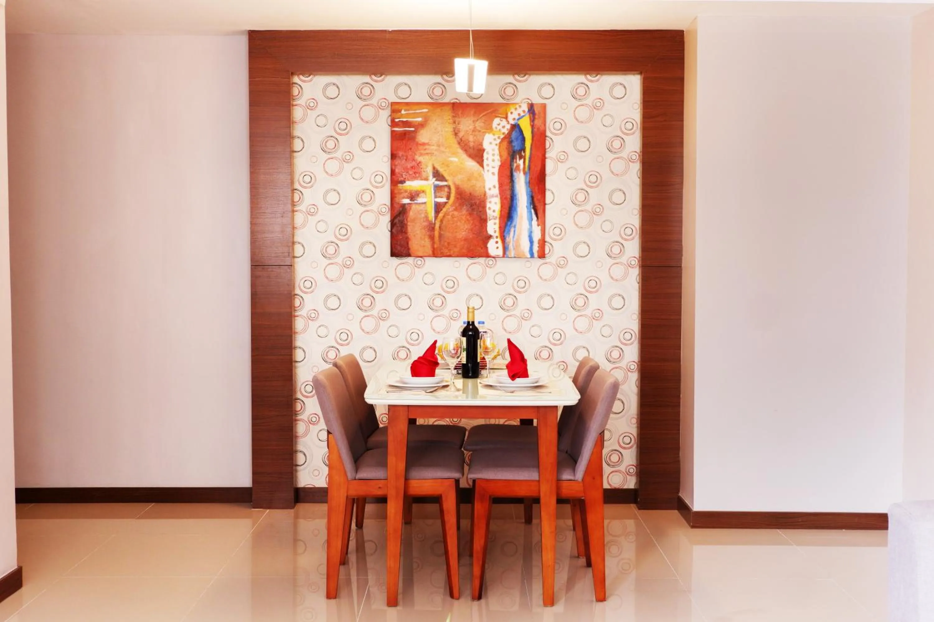 Dining area in Valero Grand Suites by Swiss-Belhotel