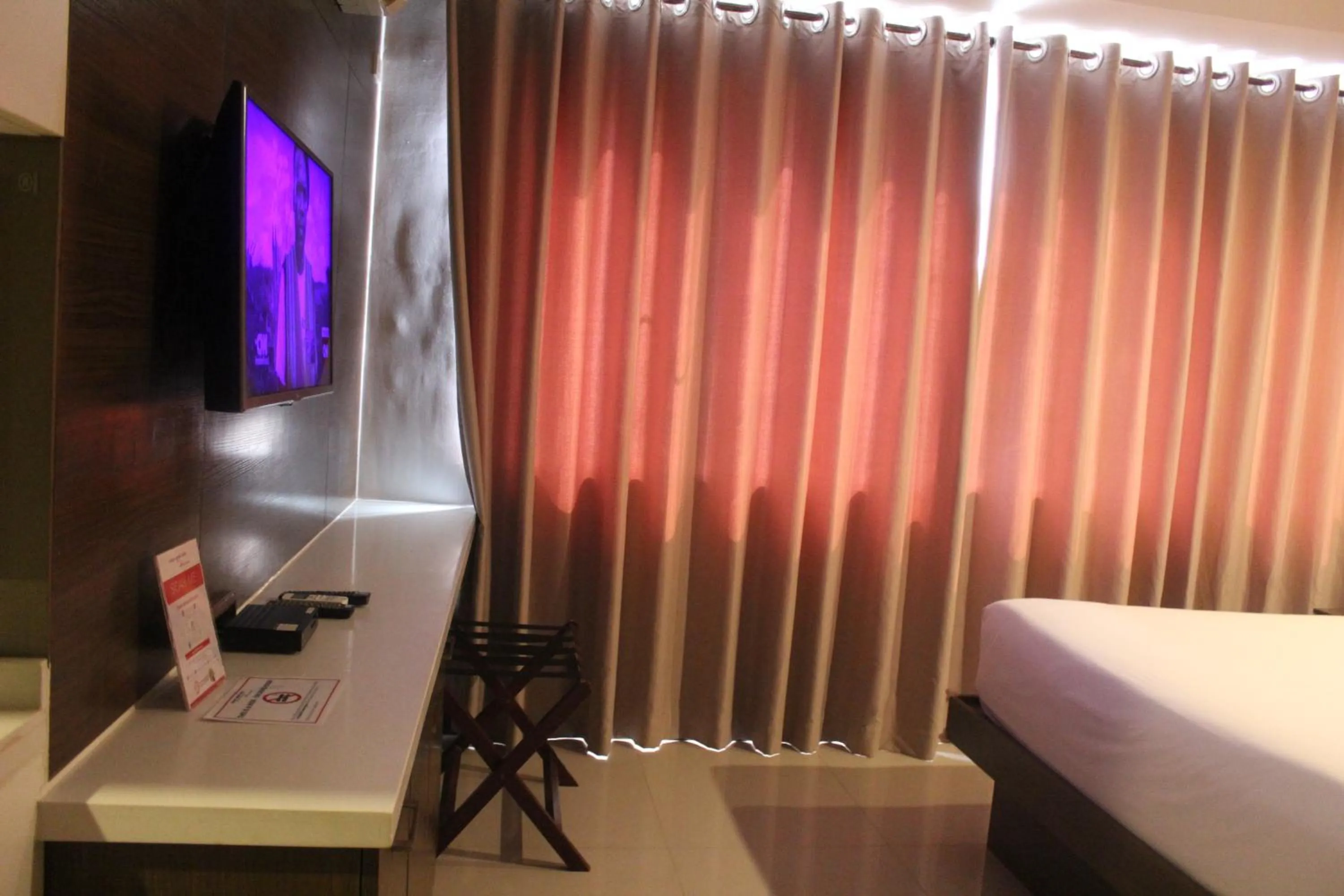 Bed in Valero Grand Suites by Swiss-Belhotel