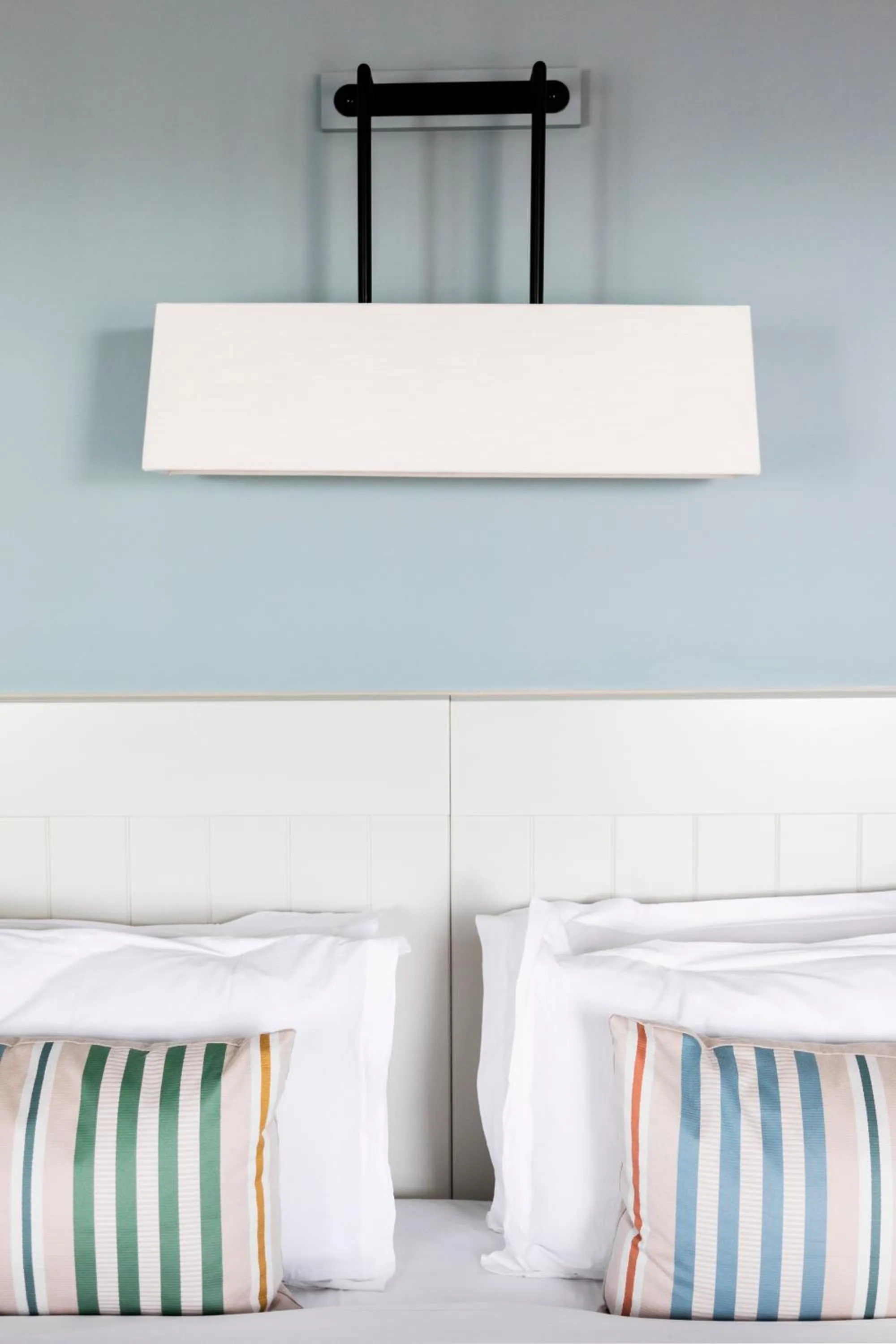 Bed in The Relais Cooden Beach and Spa