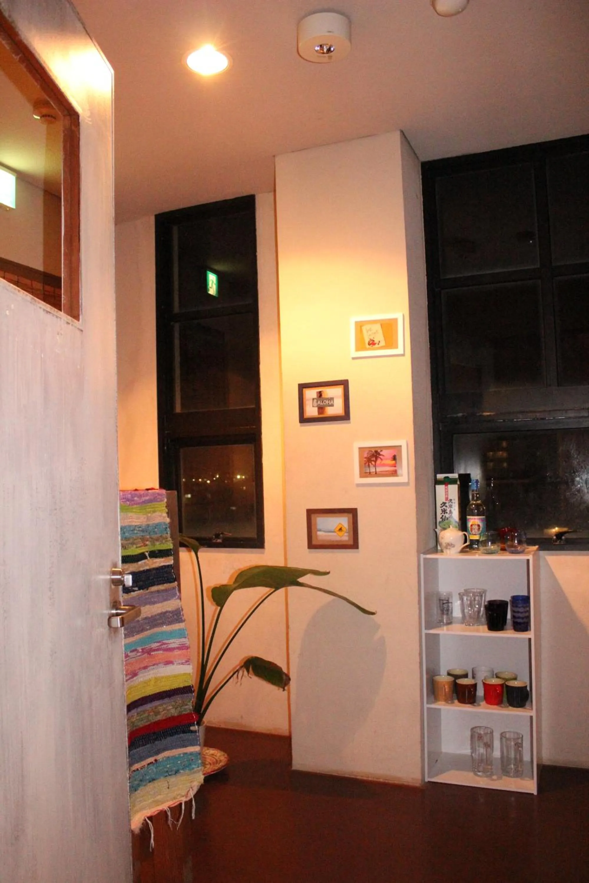 Communal lounge/ TV room in guest house Holoholo Ishigakijima