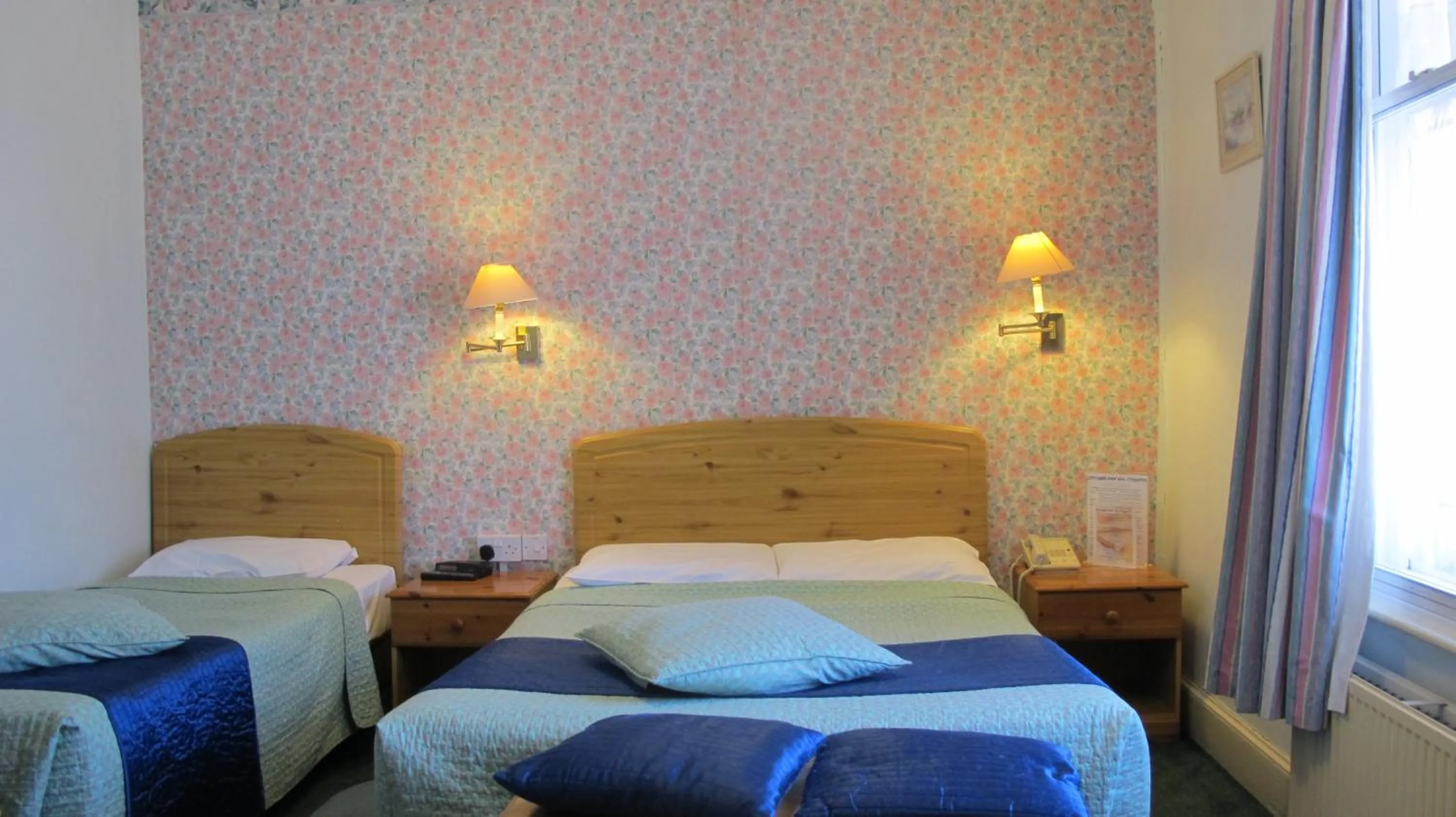 Photo of the whole room, Bed in River Hotel