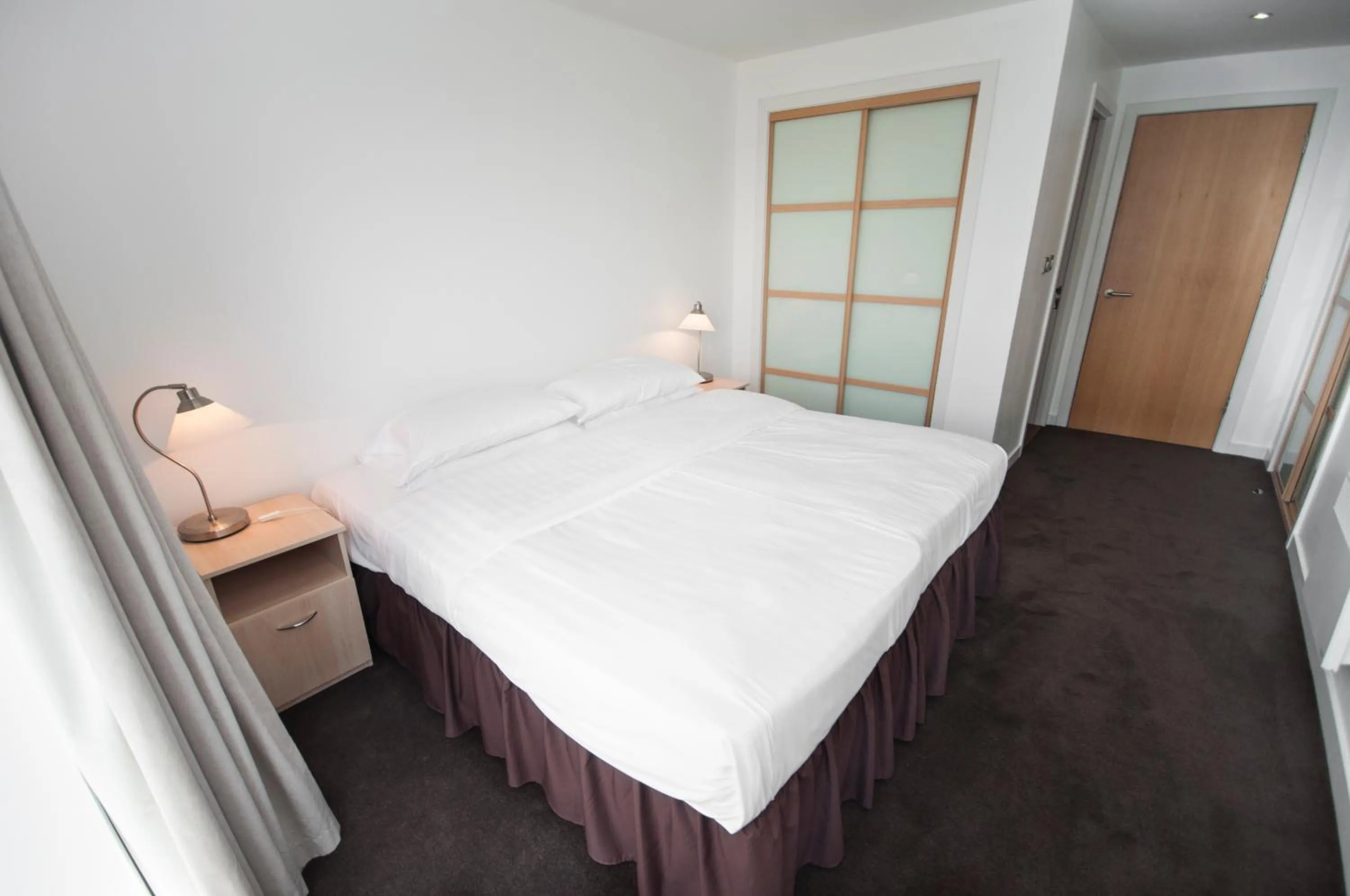 Bed in Ocean Serviced Apartments