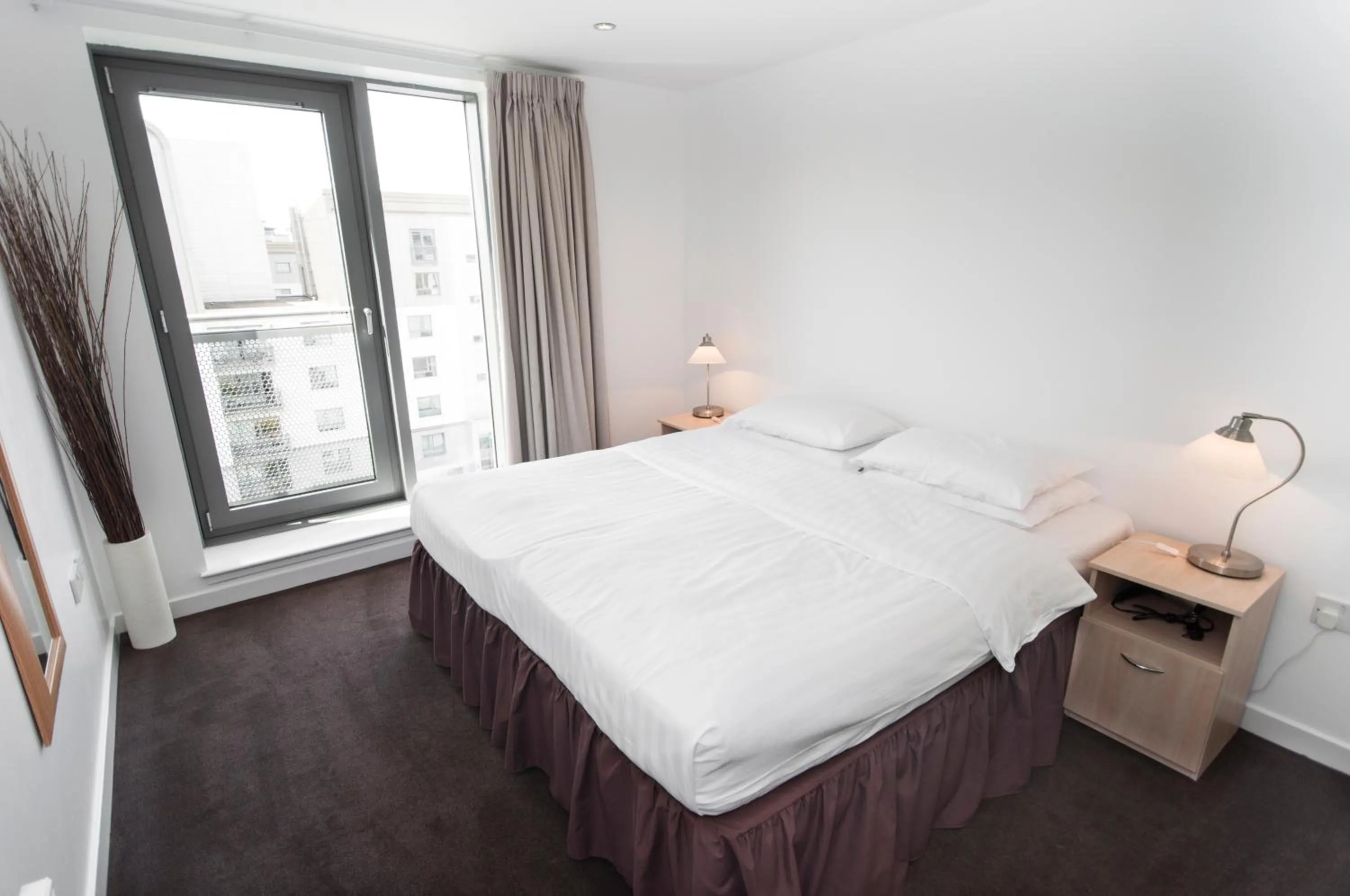 Bed in Ocean Serviced Apartments