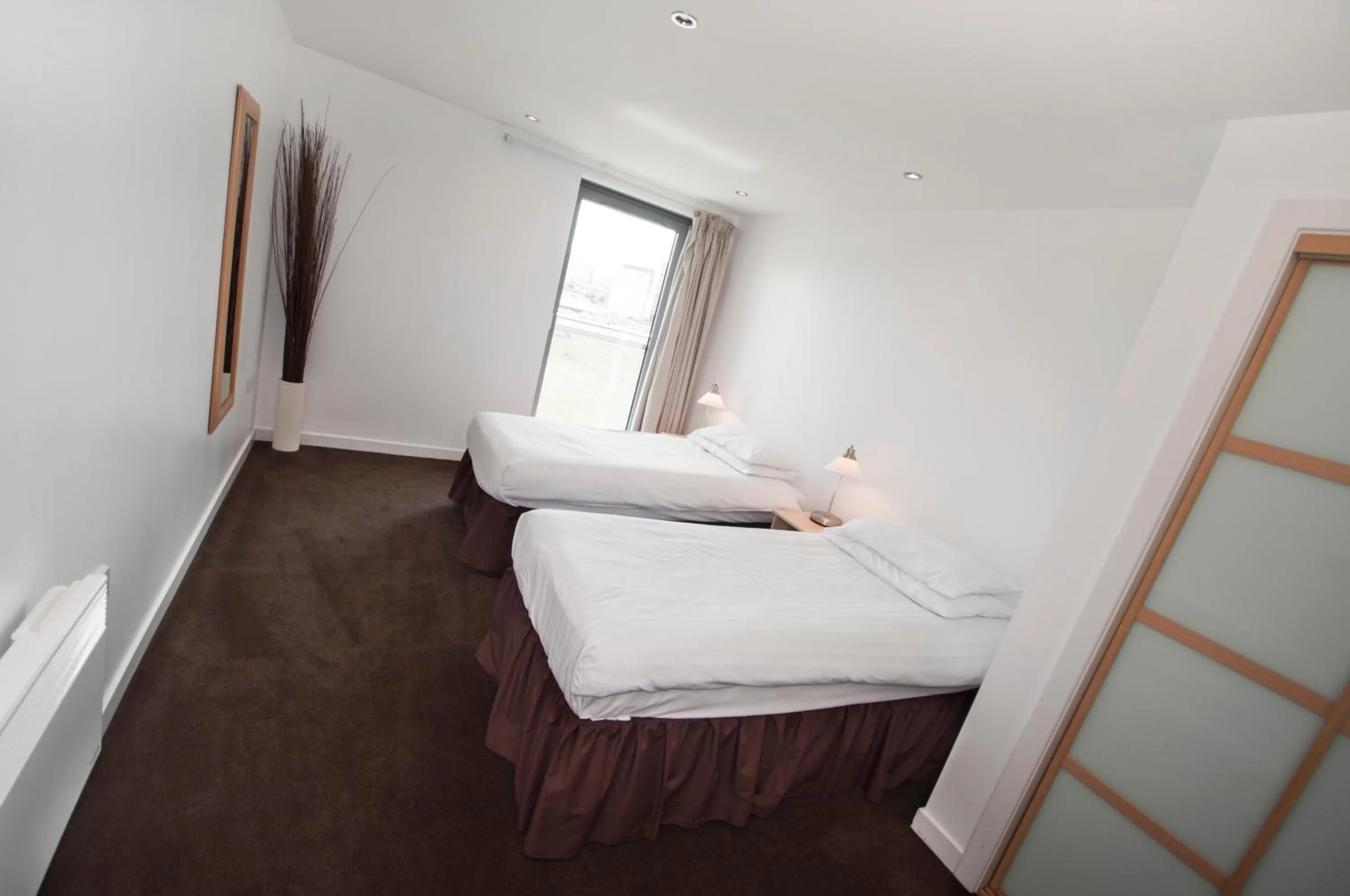 Bed in Ocean Serviced Apartments