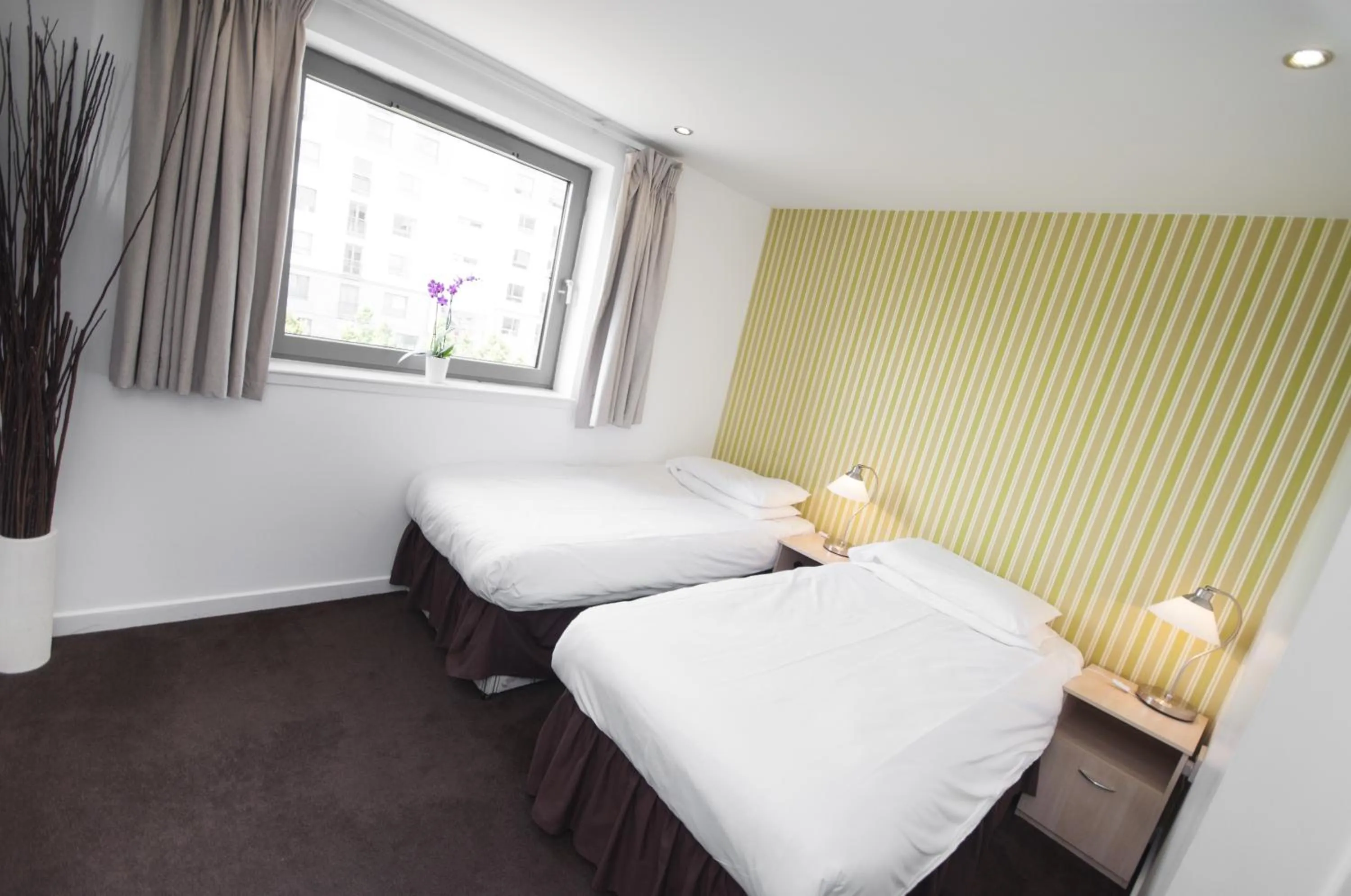 Bed in Ocean Serviced Apartments